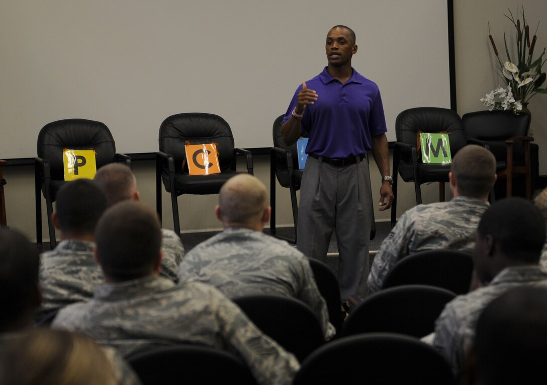 Leonard Wheeler, a former National Football League player and “game on” presenter, makes a point to Hurlburt Airmen during a “game on” presentation at the Vincent Airman Leadership School auditorium at Hurlburt Field, Fla., July 11, 2013. Wheeler guided the audience of more than 50 Air Commandos through exercises about communication and leadership. (U.S. Air Force Photo / Senior Airman Joe McFadden)

