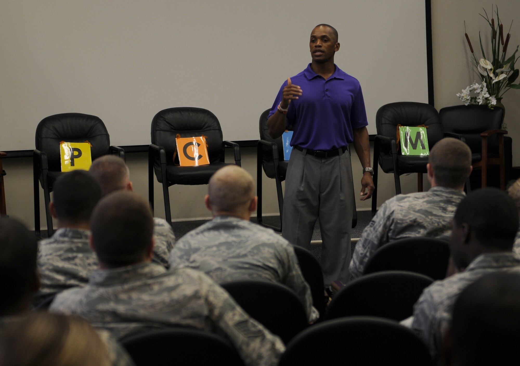 Leonard Wheeler, a former National Football League player and “game on” presenter, makes a point to Hurlburt Airmen during a “game on” presentation at the Vincent Airman Leadership School auditorium at Hurlburt Field, Fla., July 11, 2013. Wheeler guided the audience of more than 50 Air Commandos through exercises about communication and leadership. (U.S. Air Force Photo / Senior Airman Joe McFadden)

