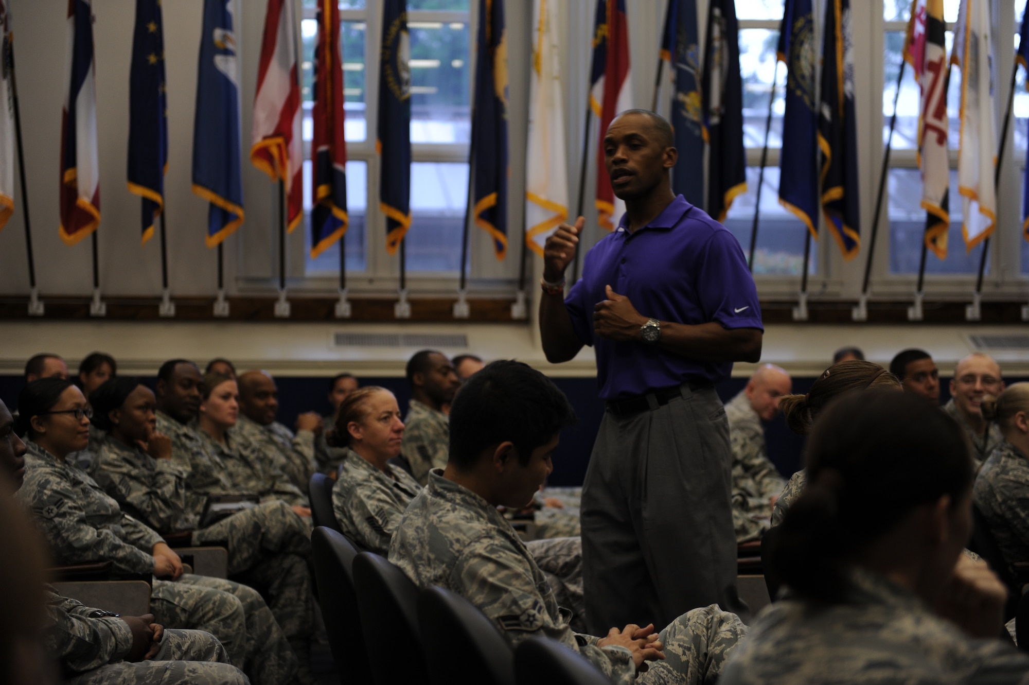 Leonard Wheeler, a former National Football League player and “game on” presenter, makes a point to Hurlburt Airmen during a “game on” presentation at the Vincent Airman Leadership School auditorium at Hurlburt Field, Fla., July 11, 2013. “Game on” is a nationwide presentation dedicated to enhancing communication skills among its audiences. (U.S. Air Force Photo / Senior Airman Joe McFadden)