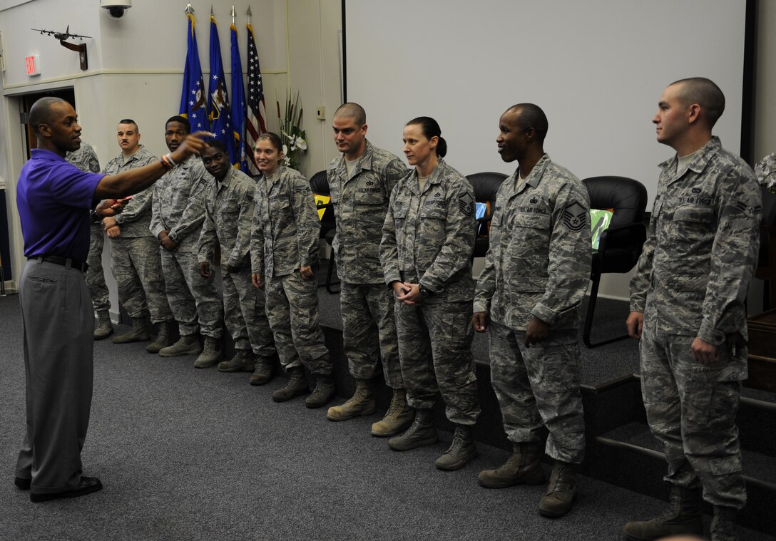 Leonard Wheeler, a former National Football League player and “game on” presenter, points to Hurlburt Airmen as part of a game during a “game on” presentation at the Vincent Airman Leadership School auditorium at Hurlburt Field, Fla., July 11, 2013. “Game on” is a nationwide seminar program dedicated to enhancing communication, leadership and confidence for their audiences. 
(U.S. Air Force Photo / Senior Airman Joe McFadden)
