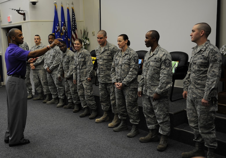 Leonard Wheeler, a former National Football League player and “game on” presenter, points to Hurlburt Airmen as part of a game during a “game on” presentation at the Vincent Airman Leadership School auditorium at Hurlburt Field, Fla., July 11, 2013. “Game on” is a nationwide seminar program dedicated to enhancing communication, leadership and confidence for their audiences. 
(U.S. Air Force Photo / Senior Airman Joe McFadden)
