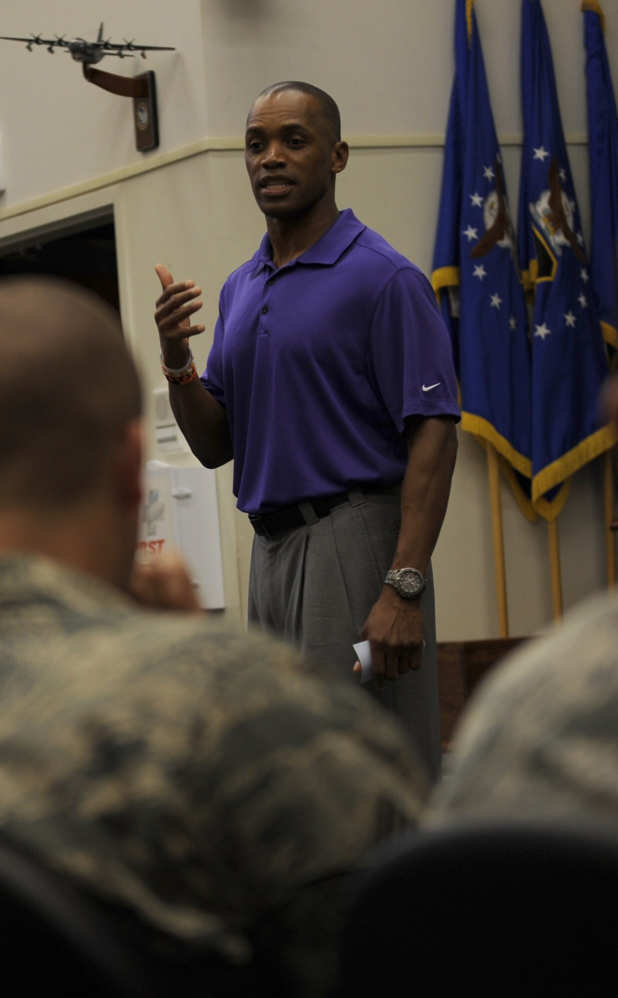 Leonard Wheeler, a former National Football League player and “game on” presenter, makes a point to Hurlburt Airmen during a “game on” presentation at the Vincent Airman Leadership School auditorium at Hurlburt Field, Fla., July 11, 2013. “Game on” presentations have been given to companies across the country including NASCAR, the New York Yankees and Honda. (U.S. Air Force Photo / Senior Airman Joe McFadden)