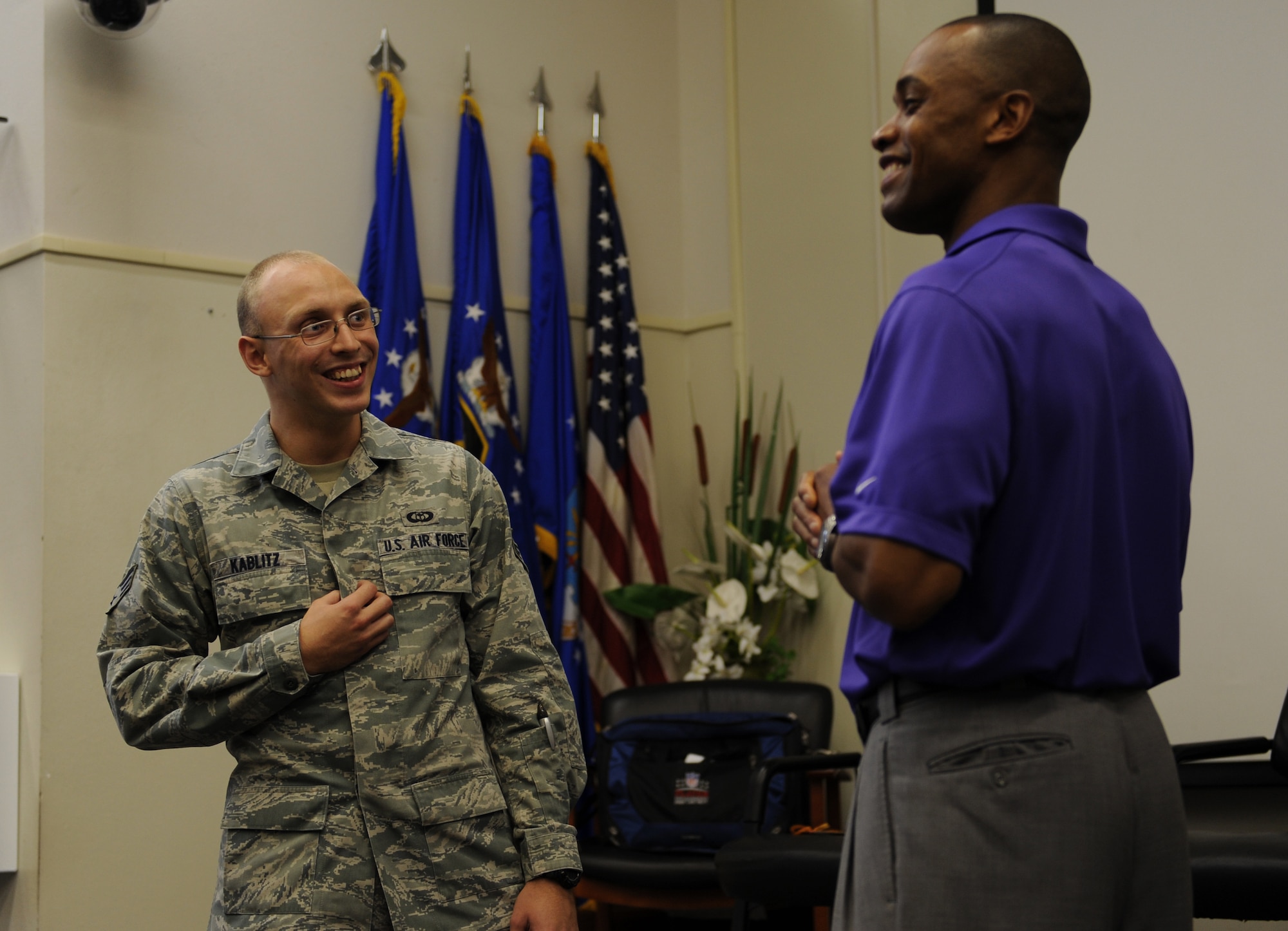 Senior Airman Kier Kablitz, a weather and communications evaluator with 2nd Combat Weather Systems Squadron, left, interacts with Leonard Wheeler, a former National Football League player and “game on” presenter, right, during a “game on” presentation at the Vincent Airman Leadership School auditorium at Hurlburt Field, Fla., July 11, 2013. Wheeler challenged more than 50 Air Commandos in attendance with games targeted at enhancing their communication skills. (U.S. Air Force Photo / Senior Airman Joe McFadden)