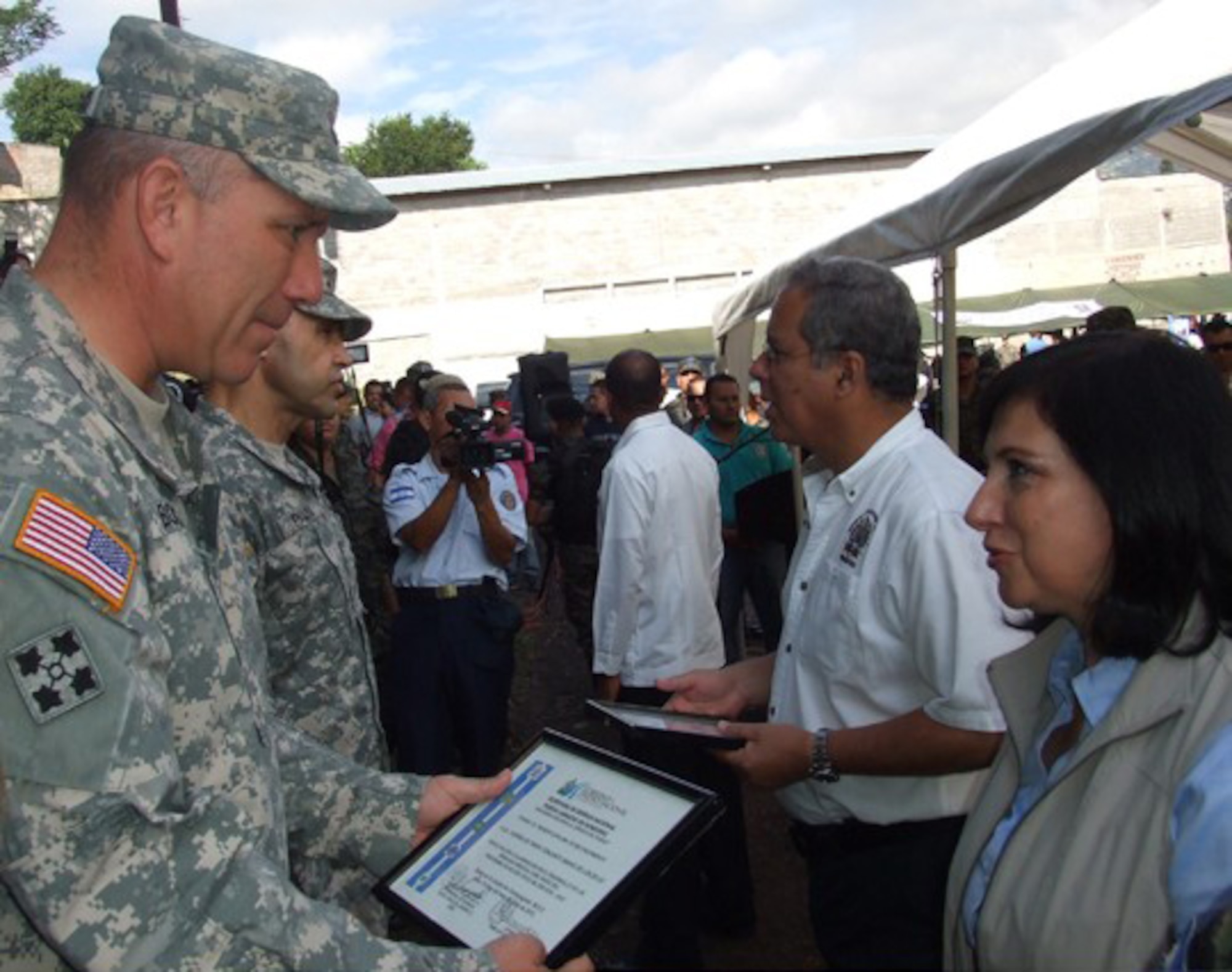 Joint Task Force –Bravo Commander, Col. Thomas Boccardi accepts an appreciation award  from the Honduran First Presidential Designate Maria Antonieta Guillen de Borgran (Honduran equivalent to the U.S. vice president) and the Honduran Armed Forces (HOAF), during an award ceremony in Tegucigalpa for providing Medical Readiness Training Exercises, which aided its one-million Honduran citizen, July 13. JTF-Bravo conducts MEDRETEs throughout Central America each year in support of U.S. Southern Command's humanitarian assistance and disaster relief programs. In coordination with the Offices of Security Cooperation and partner nation Department of Health Officials in all seven Central American countries, JTF- Bravo has treated more than 341,500 medical patients, 67,400 dental patients and 14, 300 surgical patients over the past 20 years.