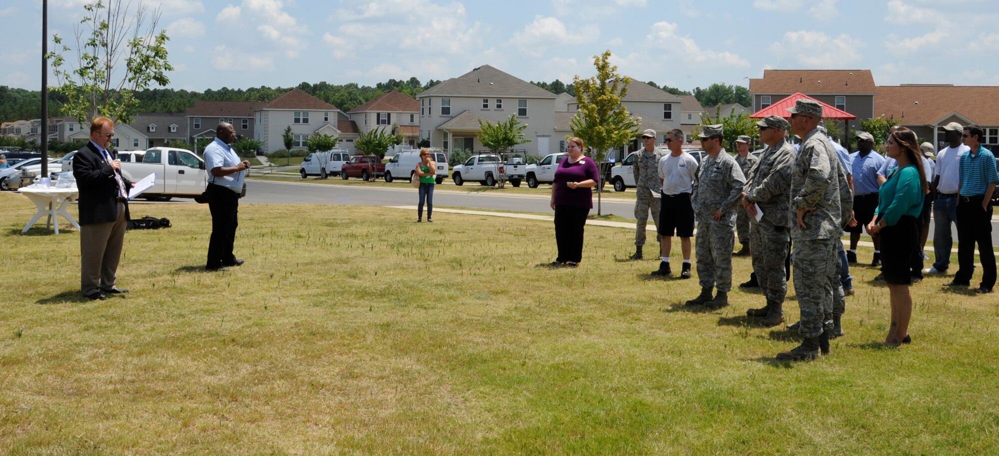 Stan Hall, left, 2nd Civil Engineer Squadron capital asset management chief, speaks to members of Team Barksdale during a groundbreaking ceremony on Barksdale Air Force Base, La., July 12, 2013. The ceremony was held to celebrate the beginning of construction on the East Reservation Community Center. (U.S. Air Force photo/Airman 1st Class Andrew Moua)