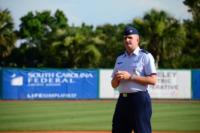 Col. Al Miller, 437th Airlift Wing vice commander, prepares to deliver the ceremonial first pitch during Military Appreciation Night July 13, 2013, at the Joseph P. Riley Jr. ballpark in Charleston, S.C. The Charleston RiverDogs hosted Military Appreciation Night to show their support for the local military. (U.S. Air Force photo/ Staff Sgt. Anthony Hyatt)