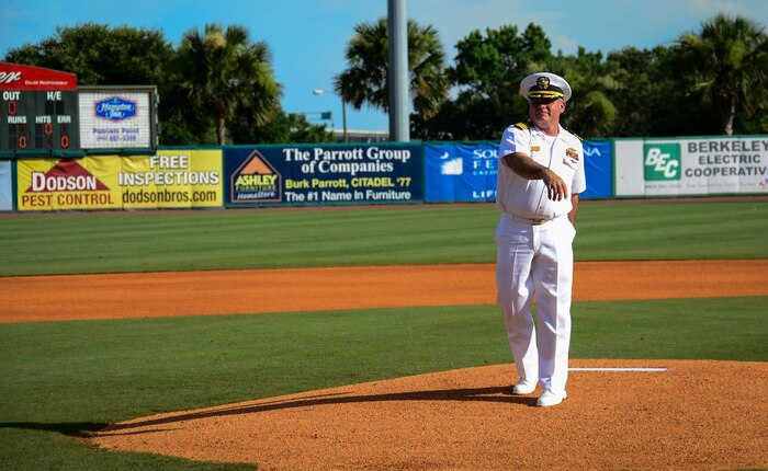 Navy Capt. Timothy Sparks, Naval Support Activity commanding officer, delivers the ceremonial first pitch during Military Appreciation Night July 13, 2013, at the Joseph P. Riley Jr. ballpark in Charleston, S.C. The Charleston RiverDogs hosted Military Appreciation Night to show their support for the local military. (U.S. Air Force photo/ Staff Sgt. Anthony Hyatt)