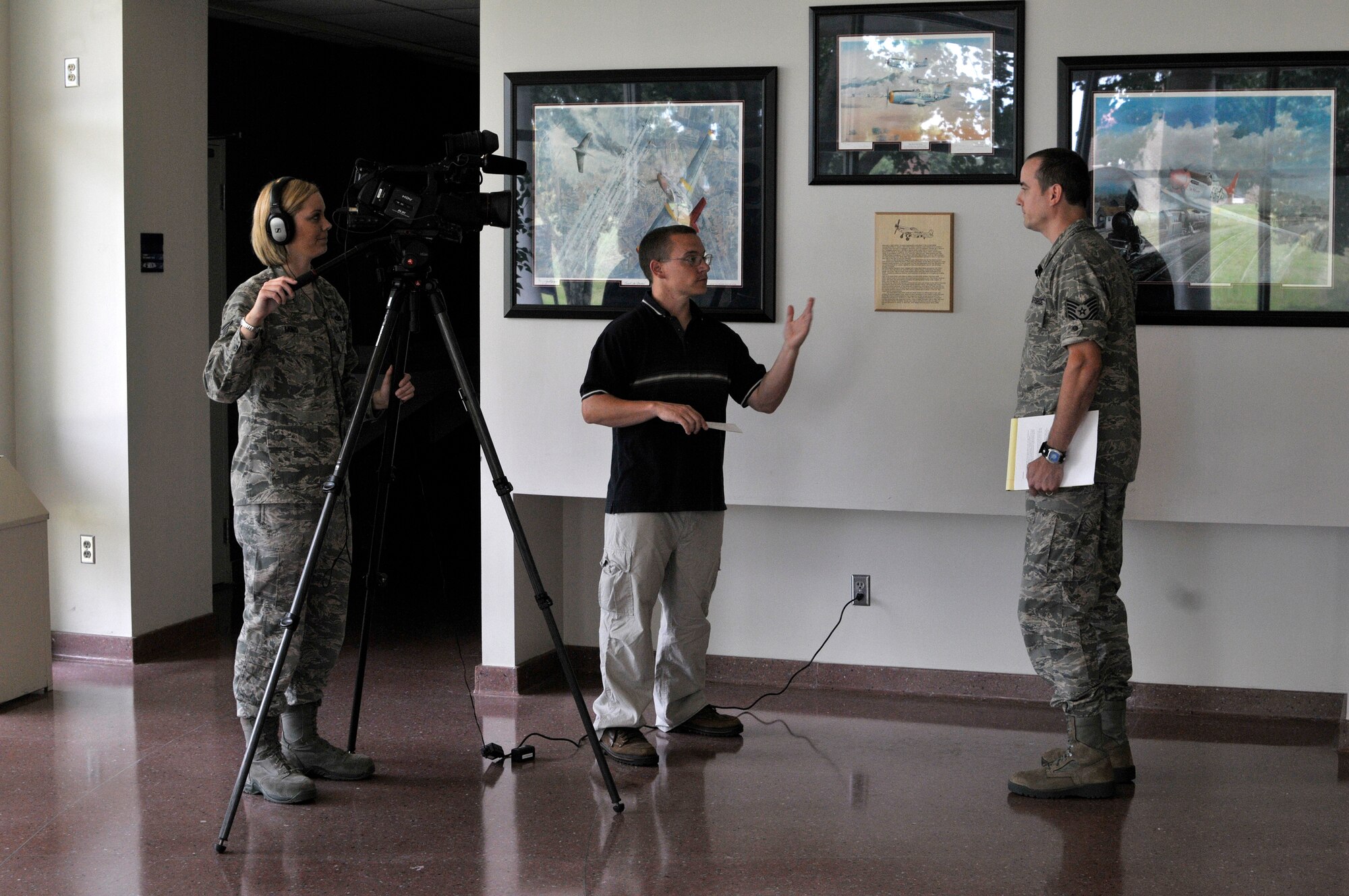 MCGHEE TYSON AIR NATIONAL GUARD BASE, Tenn. – Tech. Sgt. Amber Monio and Tech Sgt. Matt Schwartz, news directors at the I.G. Brown Training and Education Center, Media Engagement Division, act as mock media here during an interview for Tech. Sgt. Jeremy Cornelius with the 118th Wing in Tennessee. Cornelius trained as part of a simulated aircraft mishap, July 12, 2013, during the Public Affairs Managers Course. (U.S. Air National Guard photo by Master Sgt. Mike R. Smith/Released)