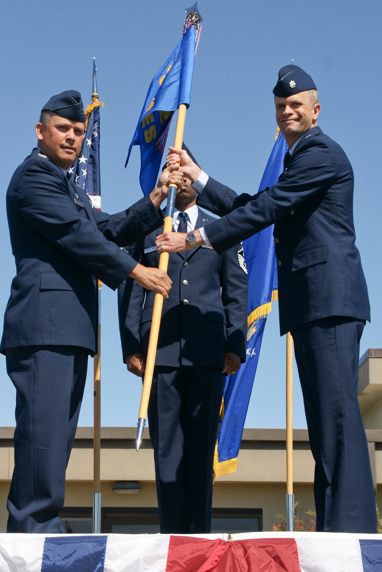 VANDENBERG AIR FORCE BASE, Calif. – Lt.Col. Deron Frailie assumes command of the 30th Civil Engineer Squadron here Monday, July 8, 2013.  Pictured from left, Col Jed Davis 30th Mission Support Group commander, Master Sgt. Matt Morganfield 30th CES first sergeant, and Lt. Col. Deron Frailie. Frailie joins Team V from the 8th Civil Engineer Squadron, Kunsan AB, South Korea. (U.S. Air Force photo/Chief Master Sgt. John Hoffman)