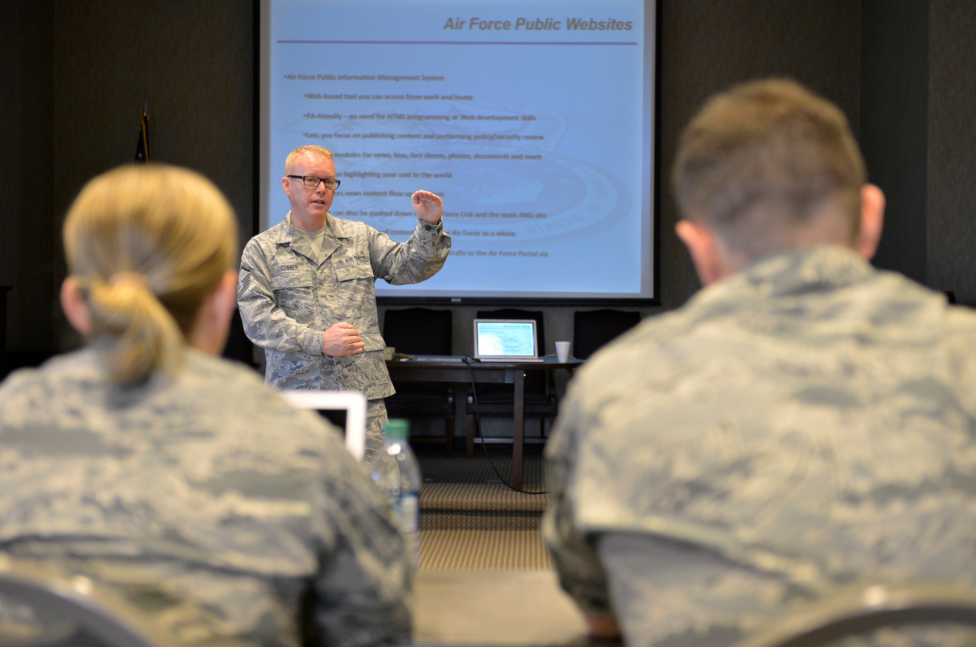MCGHEE TYSON AIR NATIONAL GUARD BASE, Tenn. – Master Sgt. Bill Conner, a public affairs training manager at the I.G. Brown Training and Education Center, speaks with Air National Guard public affairs personnel here July 12, 2013, about the Air Force Public Information Management System during the TEC’s Public Affairs Managers Course. (U.S. Air National Guard photo by Master Sgt. Kurt Skoglund/Released)