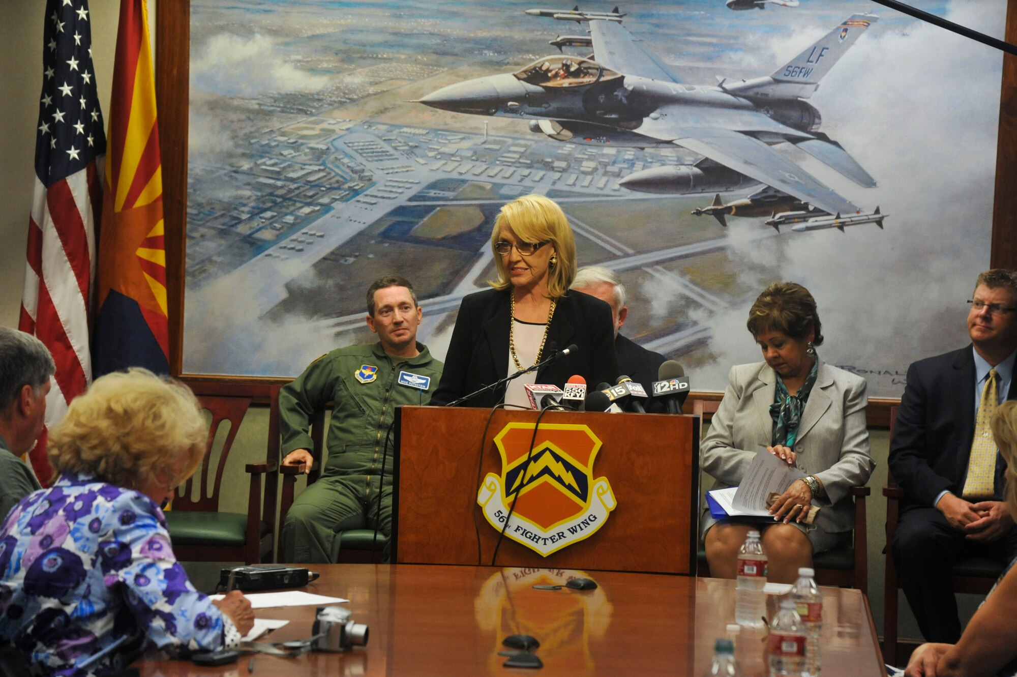 Arizona Governor Janice Brewer speaks to reporters about Luke Air Force Base being chosen as the location for 72 additional F-35A Lighting II aircraft June 27 in the Luke AFB Wing Headquarters Conference Room. The additional aircraft bring the total number of fifth-generation fighters to 144. Aircraft are expected to begin arriving at Luke in spring 2014. (U.S. Air Force photo/Senior Airman David Owsianka)