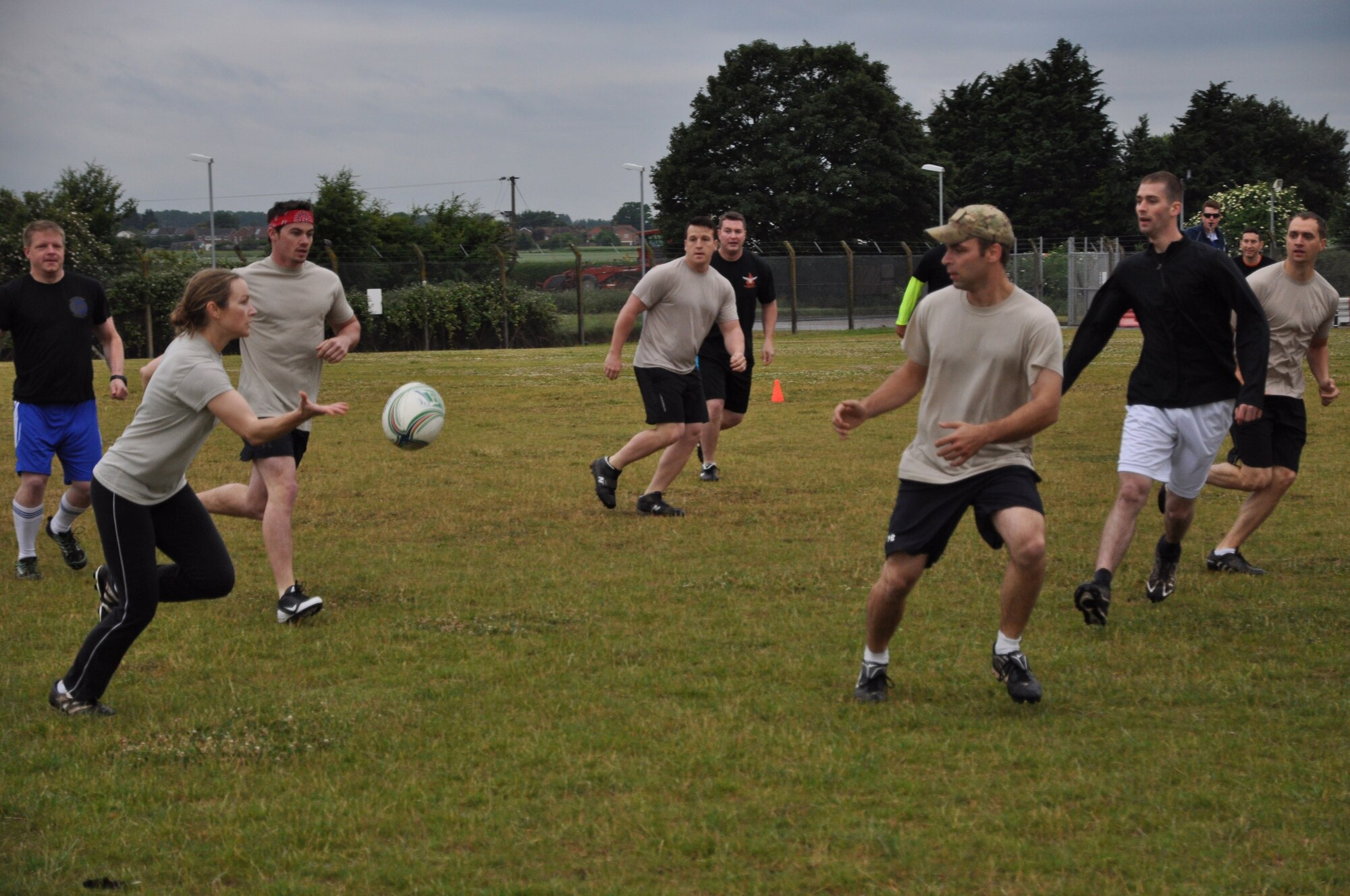Team Mildenhall members play ultimate rugby July 3, 2013 during the 352nd Special Operations Group Olympics on RAF Mildenhall, England. The 352nd SOG Olympics consisted of ultimate rugby, basketball, dodgeball, a Monster Mash and other competitions. The 352nd SOG Olympics is designed to foster teamwork and unity of action among about 1,000 members of the 352nd SOG. (U.S. Air Force photo by Capt. Jason Smith/Released)