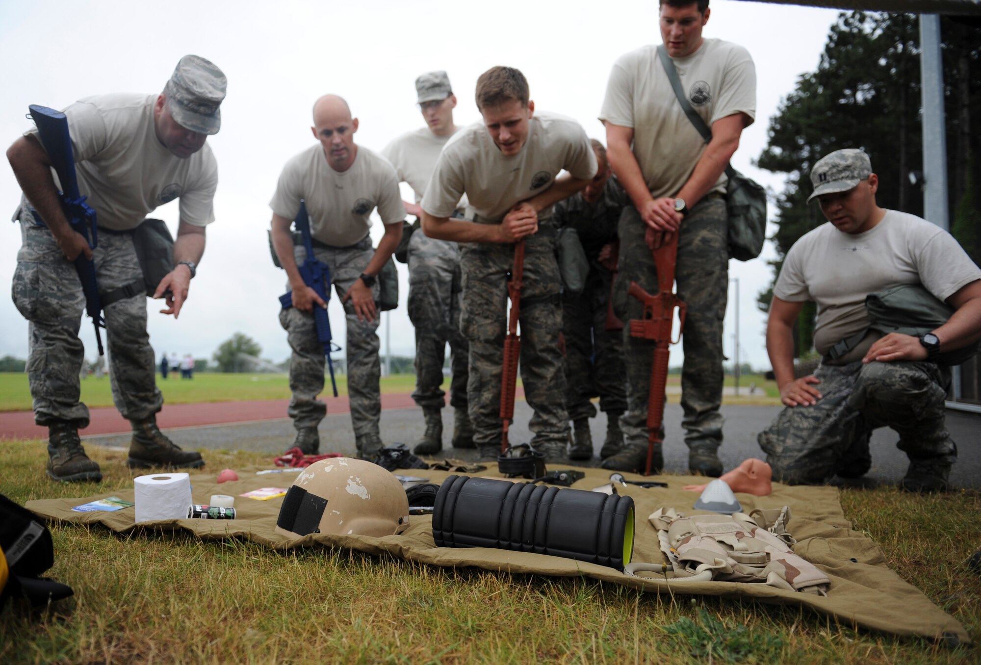 A team looks at different items during the memorization portion of the Monster Mash on RAF Mildenhall, England, July 3, 2013. The Monster Mash took most teams more than two hours to complete. The 352nd Special Operations Group Olympics consisted of, ultimate rugby, basketball, dodgeball, Monster Mash and other competitions. (U.S. Air Force photo by Airman 1st Class Preston Webb/Released)