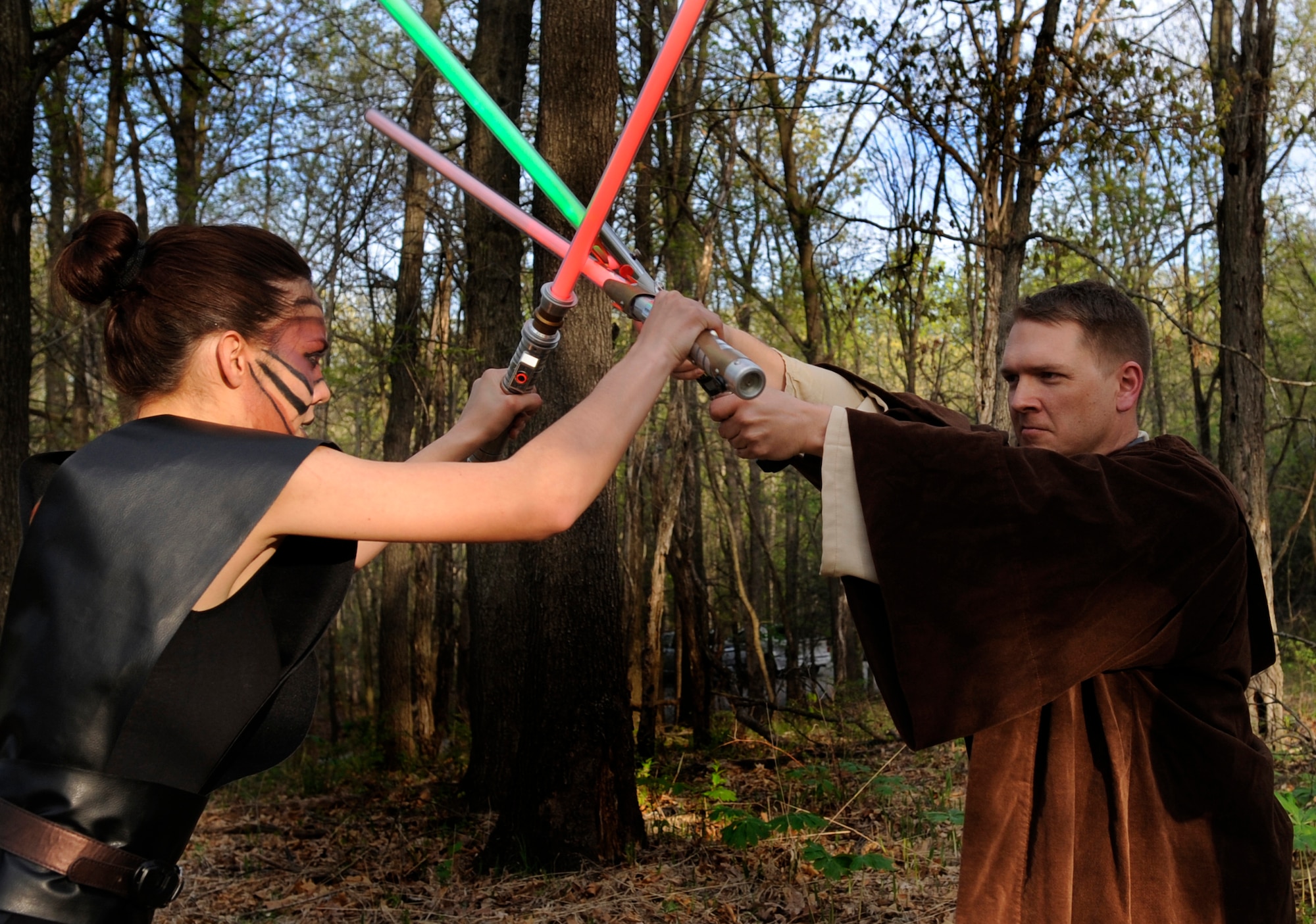 Airman 1st Class Shelby Orozco, 509th Bomb Wing Public Affairs photojournalist, and Master Sgt. Kenneth Hampton, 509th Medical Group NCO-in-charge of education and training, test the durability of Hampton’s lightsabers, May 7, 2013. Hampton wanted a particular shape and a crystal chamber for his lightsabers similar to one he had seen in the “Star Wars” movies. (U.S. Air Force photo by Staff Sgt. Alexandra M. Boutte/Released)