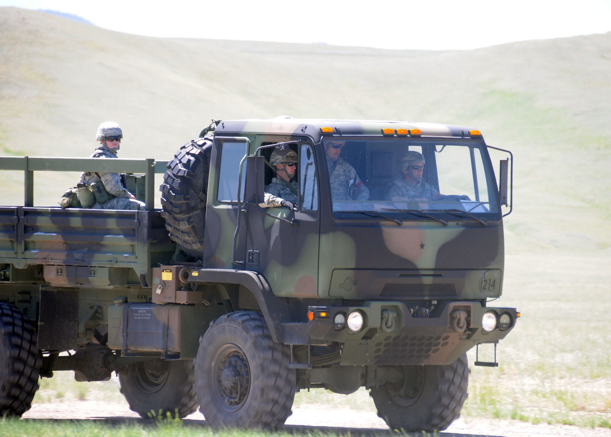 Members of the 219th RED HORSE Squadron conduct vehicle training during a field training exercise at Fort Harrison, Mont. June 10, 2013.  The squadron participated in contingency training during their unit training assembly. (U.S. Air Force photo/2nd Lt Robin Jirovsky)