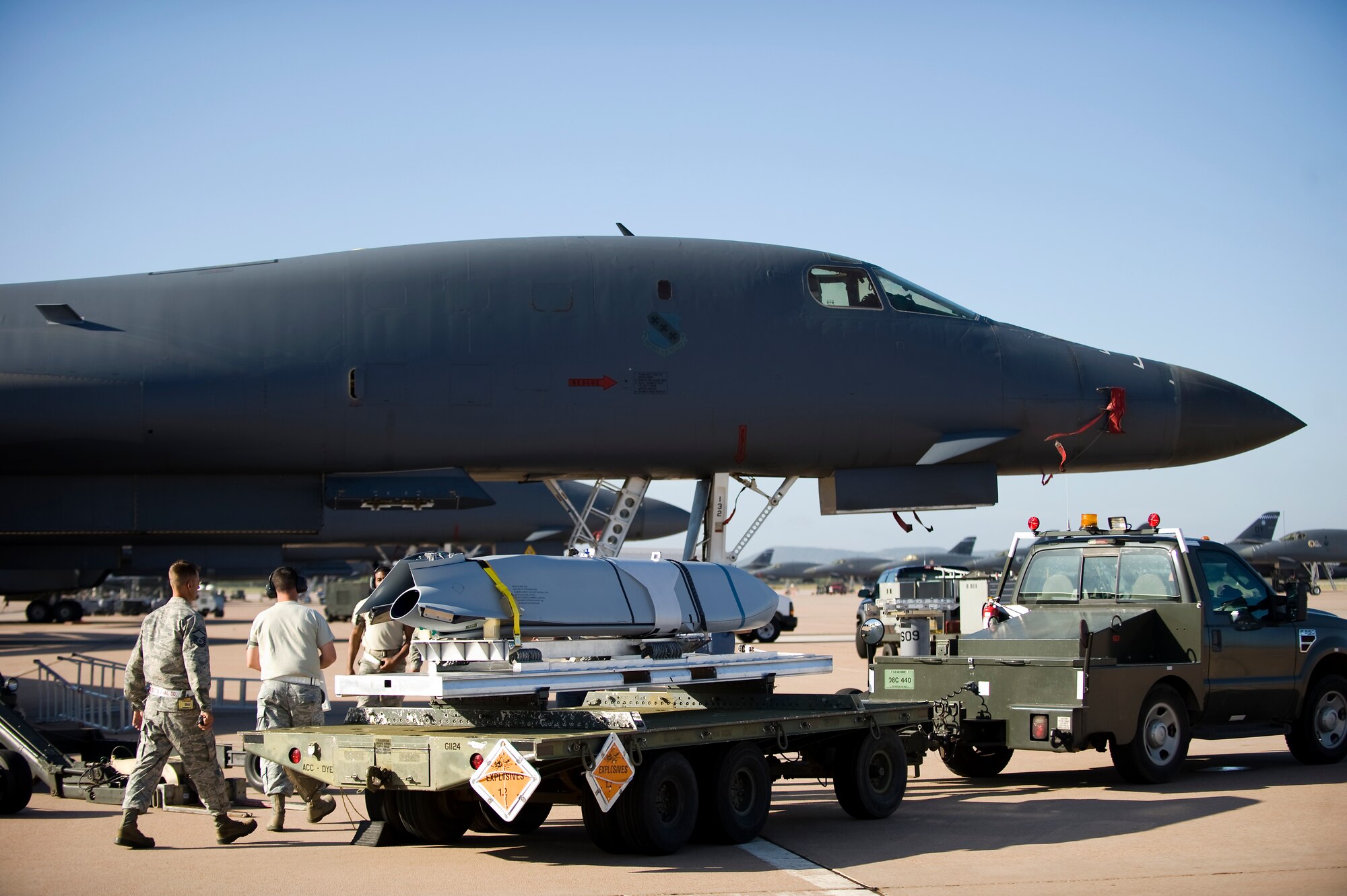 U.S. Air Force Airmen from the 7th Munitions Squadron transport a Long Range Anti-Ship Missile (LRASM) toward a B-1 Bomber June 12, 2013, at Dyess Air Force Base, Texas. The weapon loading was part of a trial-run for munitions Airmen prior to the first captive carry test conducted by the 337th Test and Evaluation Squadron on June 17. (U.S. Air Force photo by Airman 1st Class Damon Kasberg/Released)