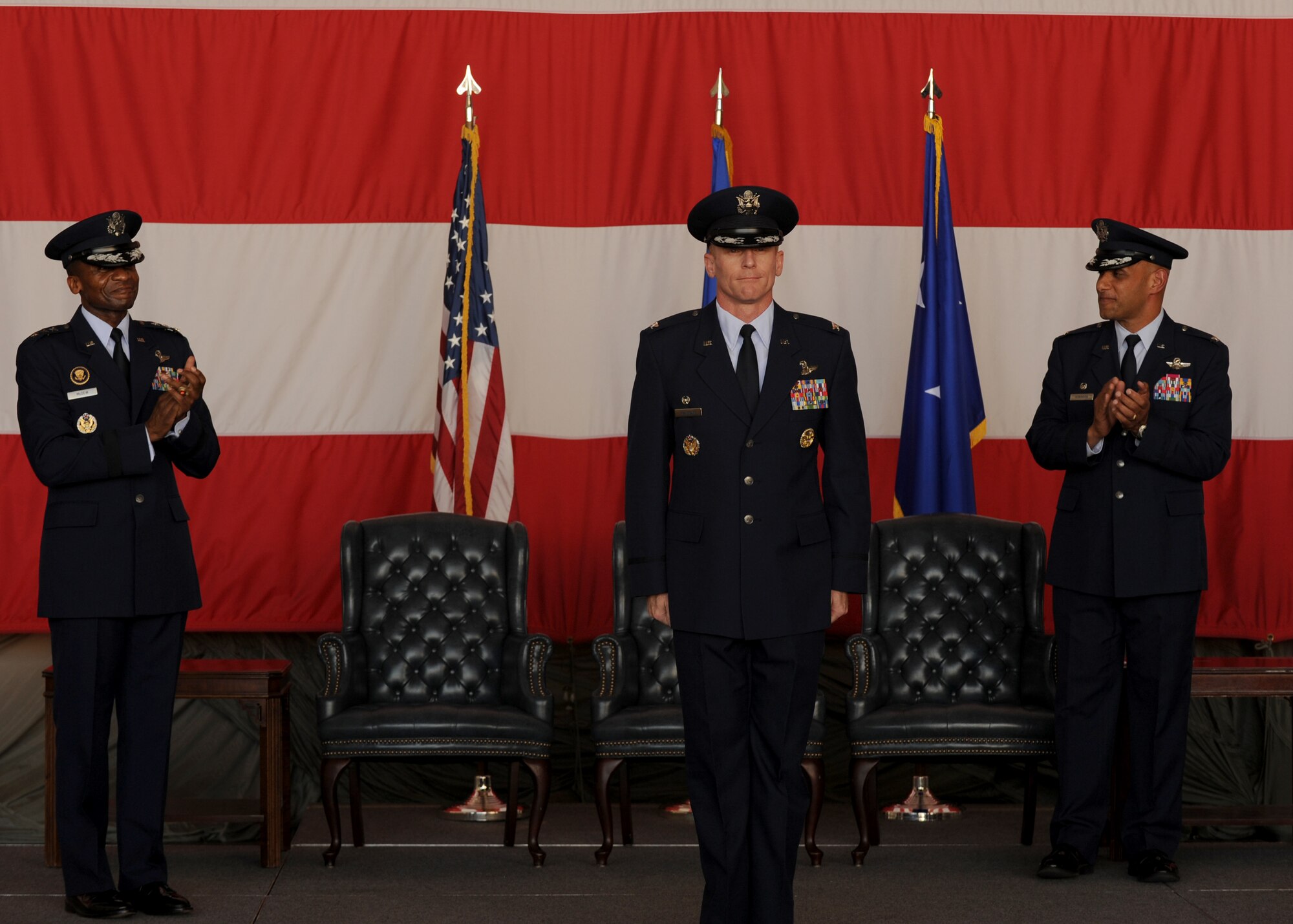 Col. Patrick Rhatigan is presented as the new 19th Airlift Wing commander during a ceremony July 9, 2013, at Little Rock Air Force Base, Ark. Rhatigan assumed command of the Black Knights from Col. Brian Robinson in a ceremony officiated by Lt. Gen. Darren McDew,  18th Air Force commander. (U.S. Air Force photo by Airman 1st Class Scott Poe)