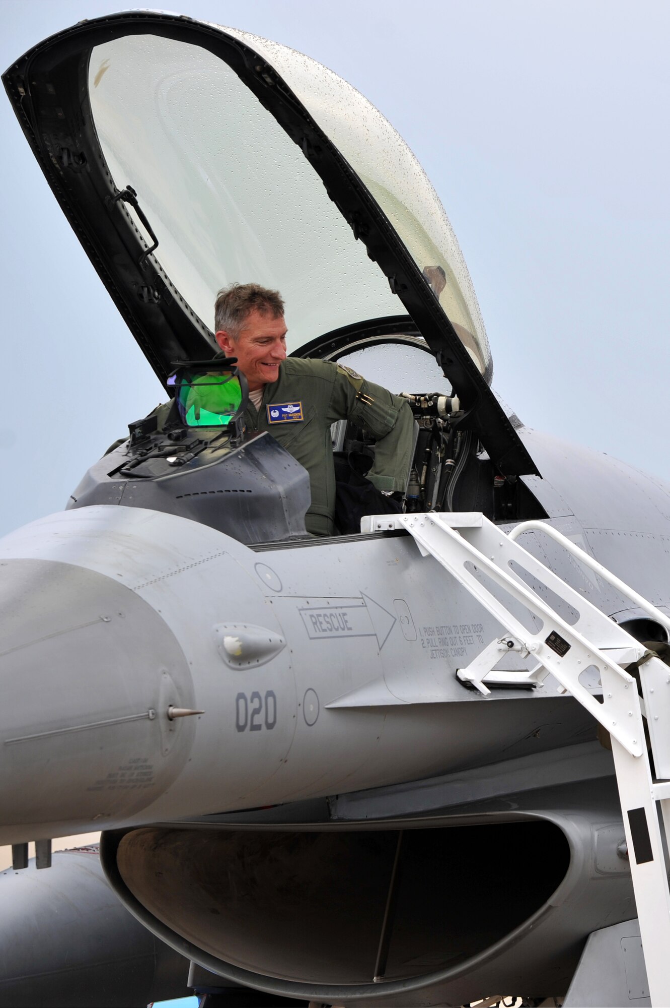 Col. Patrick McKenzie, 51st Fighter Wing commander, prepares to climb out of an F-16 Fighting Falcon after completing his final flight at Osan Air Base, Republic of Korea, July 11, 2013. McKenzie is a command pilot with more than 3,000 flying hours, including 180 combat missions in Iraq, Bosnia, Kosovo, and Afghanistan. (U.S. Air Force photo/Staff Sgt. Emerson Nuñez)