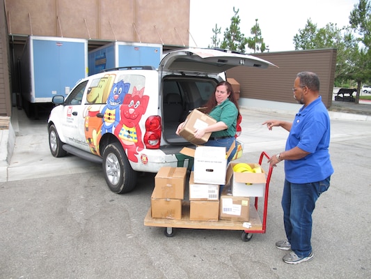 Bass Pro Shops' Special Event Specialist Shannon Gauthier and District Safety Specialist Anthony Henson assisted with delivering educational information donated by the U.S. Army Corps of Engineers for Bass Pro Shops "Family Summer Camp" campaign. 