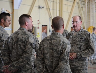 Senior Airman Gregory Quailer, 2nd Munitions Squadron, speaks to Gen. C. Robert Kehler, United States Strategic Command commander, about GBU-10 laser-guided bombs which are used on the B-52H Stratofortress on Barksdale Air Force Base, La., July 15, 2013. Kehler met with 2nd Bomb Wing Airmen to discuss the longevity and versatility of the B-52. (U.S. Air Force photo/Airman 1st Class Benjamin Gonsier)