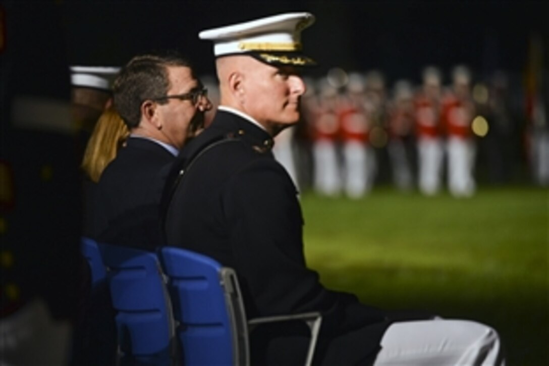 Deputy Defense Secretary Ash Carter observes the evening parade at the Marine Corps Barracks in Washington, D.C., July 12, 2013. Carter was the guest of honor at the parade. 