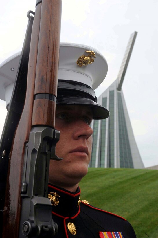 Lance Cpl. Eric Mcgensen, member of the Marine Silent Drill Platoon, practices drill moves before a performance at the National Museum of the Marine Corps on July 12, 2013. The routine was part of a Summer Concert Series hosted by the Marine Corps Heritage Foundation.