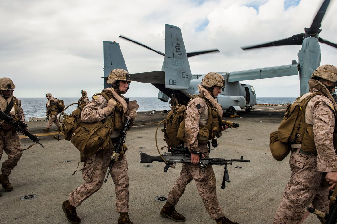 Marines assigned to the 31st Marine Expeditionary Unit disembark an MV-22 Osprey on the flight deck of the forward-deployed amphibious assault ship USS Bonhomme Richard (LHD 6) after conducting a helicopter assault training exercise. The 31st MEU and Amphibious Squadron 11 are participating in exercise Talisman Saber 2013, a bilateral training exercise between the U.S. and Australian militaries, bolstering their interoperability and combat readiness as a Combined Joint Task Force. 