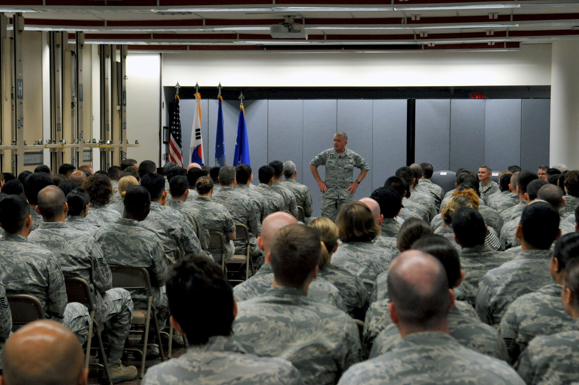 Lt. Gen. Thomas Travis, Air Force surgeon general, answers a question presented by an Airman during a 51st Medical Group all-call at the garden court on Osan Air Base, Republic of Korea, July 15, 2013. The surgeon general’s tour of the medical facility included the emergency room, radiology, flight medicine, the laboratory, orthopedics and operating rooms. (U.S. Air Force photo/Senior Airman Kristina Overton)

