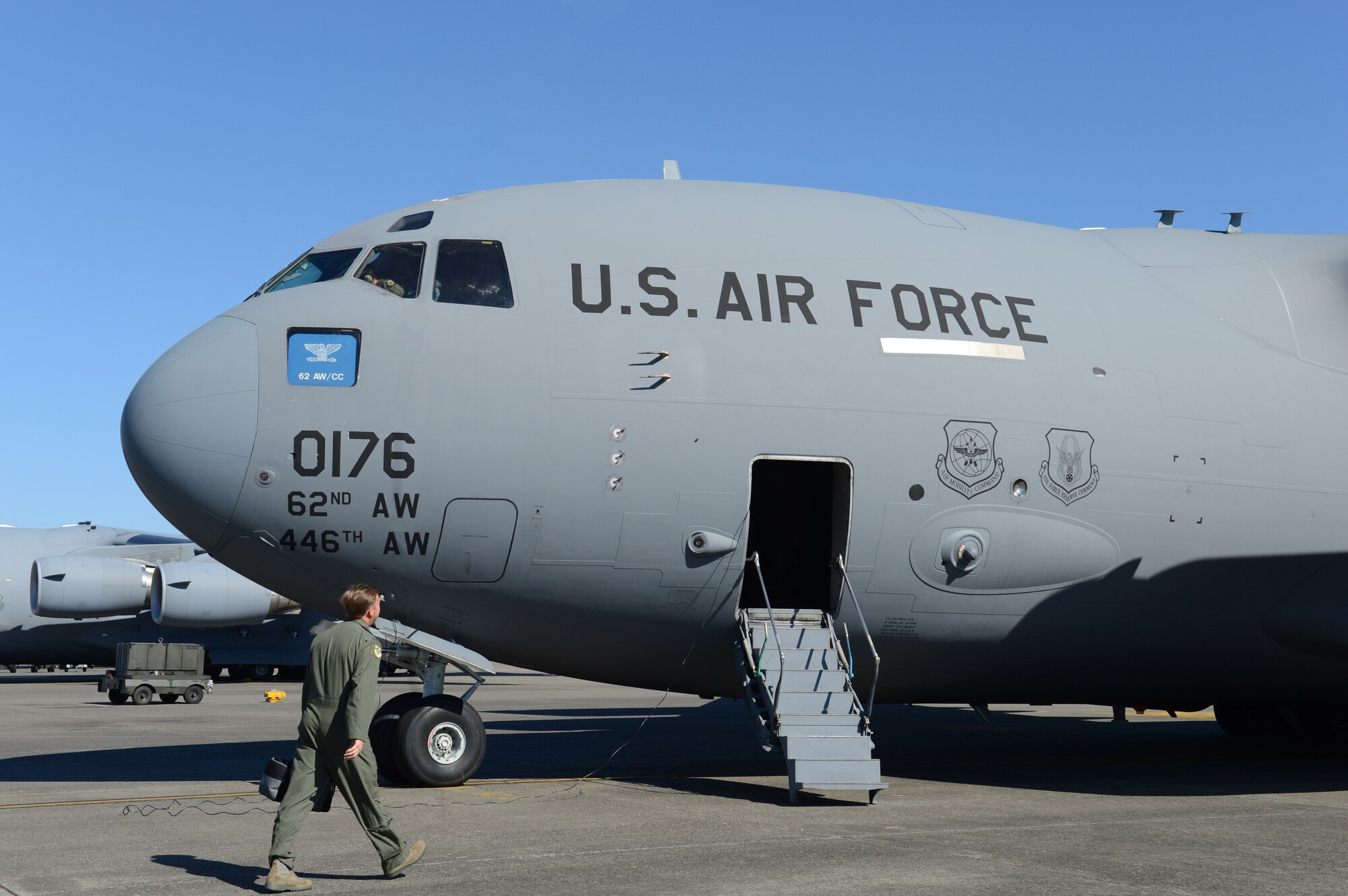 Col. Wyn Elder, 62nd Airlift Wing commander, walks toward a C-17 Globemaster III aircraft  in preparation for his "fini flight" July 15, 2013 at Joint Base Lewis-McChord, Wash. During the flight, Elder also conducted air refueling training and low-level flying. (U.S. Air Force photo/Staff Sgt. Frances Kriss)