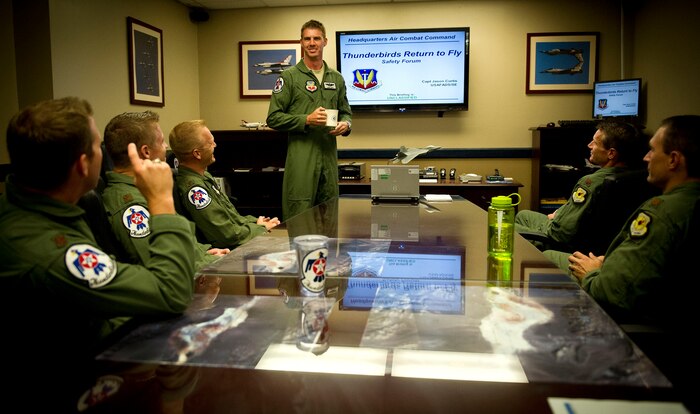 Capt. Jason Curtis, Thunderbird 6, moderates a safety forum with fellow officers in the USAF Thunderbirds’ hangar at Nellis Air Force Base, Nev., July 16, 2013. In addition to flying as the team’s opposing solo pilot, Curtis serves as the team’s safety officer. Temporary funding has allowed the squadron to resume flying for proficiency training purposes; the Thunderbirds will spend the next few days focusing on safety prior to actually putting jets in the air. (U.S. Air Force photo by Tech. Sgt. Manuel J. Martinez)