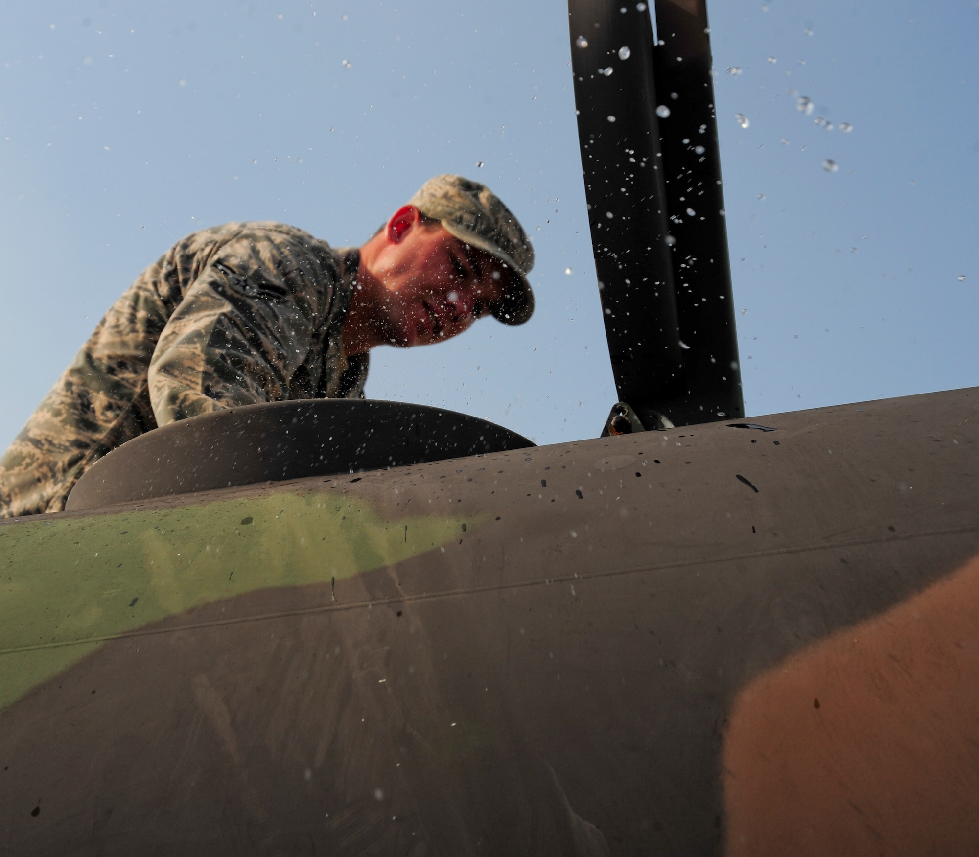 Airman 1st Class Bryce Weaver, 11th Civil Engineer Squadron, fills water buffalos to distribute across Joint Base Andrews, Md., in preparation for a scheduled water outage.  The Washington Suburban Sanitary Commission has stated portions of southern Prince George’s County will be without water for two to five days while repairs are made to the deteriorating pipelines. (U.S. Air Force photo/Airman 1st Class Erin O’Shea) 