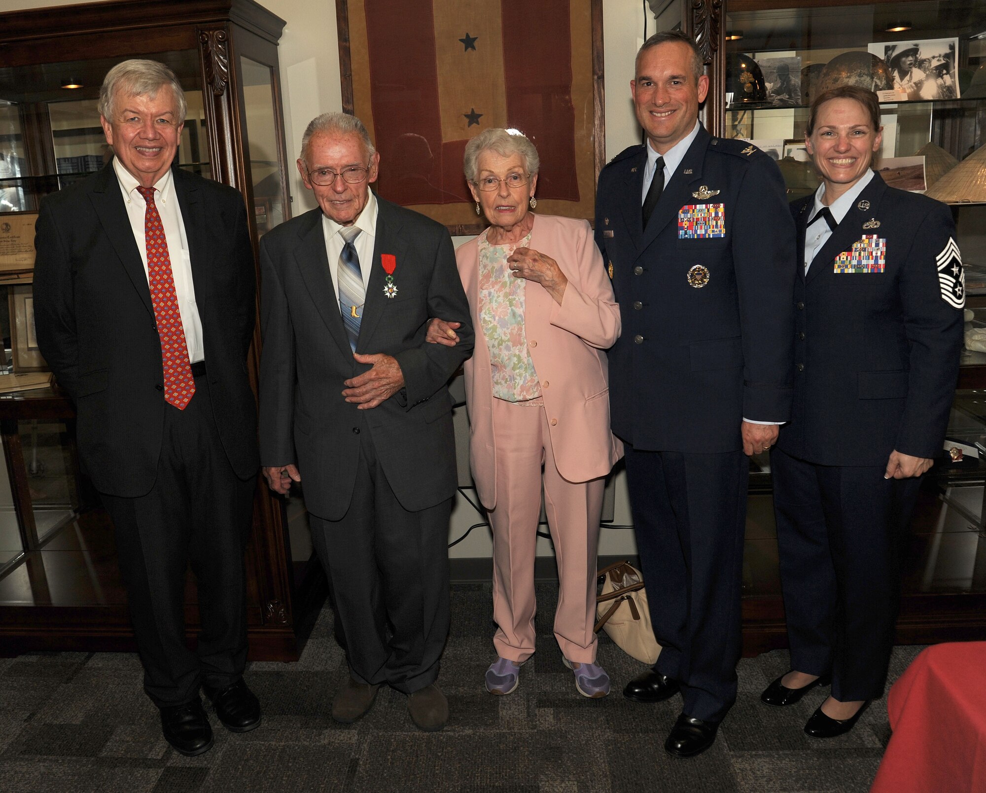 Jack Cowan, Honorary Consul of France, Mr. Del Casper, Army Air Corps B-17 gunner, Mrs. Grace Casper, Col. Brian Newberry, 92nd Air Refueling Wing commander, and Chief Master Sgt. Wendy Hansen, 92nd Air Refueling Wing command chief, pose for a picture during Casper's French Legion of Honor medal ceremony at the Spokane Veterans Center in Spokane Valley, Wash., July 15, 2013.  Casper received the medal for his bravery during WWII.  (U.S. Air Force photo by Senior Airman Samantha Krolikowski/Released)