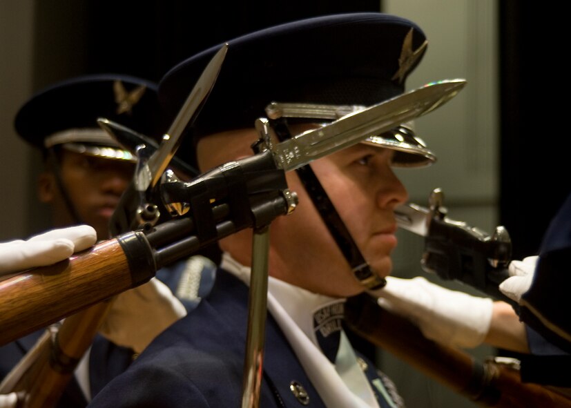 U.S. Air Force Ceremonial Honor Guardsmen position their bayonets within inches of each other’s heads July 15, 2013, at Dyess Air Force Base, Texas. The four-rifle routine is the smallest group and most difficult routine the honor guard presents, requiring the most talented ceremonial guardsmen. (U.S. Air Force photo by Airman 1st Class Peter Thompson/Released)