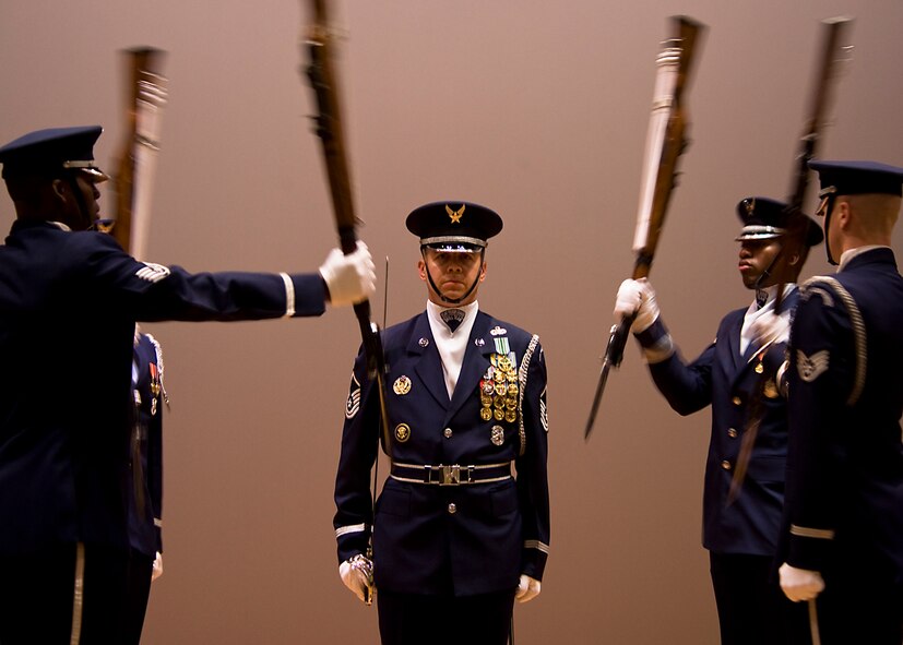 U.S. Air Force Ceremonial Honor Guardsman practice their four-rifle routine July 15, 2013, at Dyess Air Force Base, Texas. Air Force Honor Guardsmen are trained to display the utmost professionalism, discipline and precision during any engagement they take part in. (U.S. Air Force photo by Airman 1st Class Peter Thompson/Released)