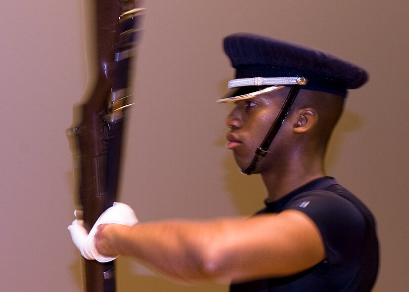 U.S. Air Force Senior Airman Marcus Davis, Air Force Honor Guard ceremonial guardsman, practices his drill routine July 15, 2013, at Dyess Air Force Base, Texas. The three primary components of the Air Force Honor Guard are the color guard, firing party and body bearers. (U.S. Air Force photo by Airman 1st Class Peter Thompson/Released)
