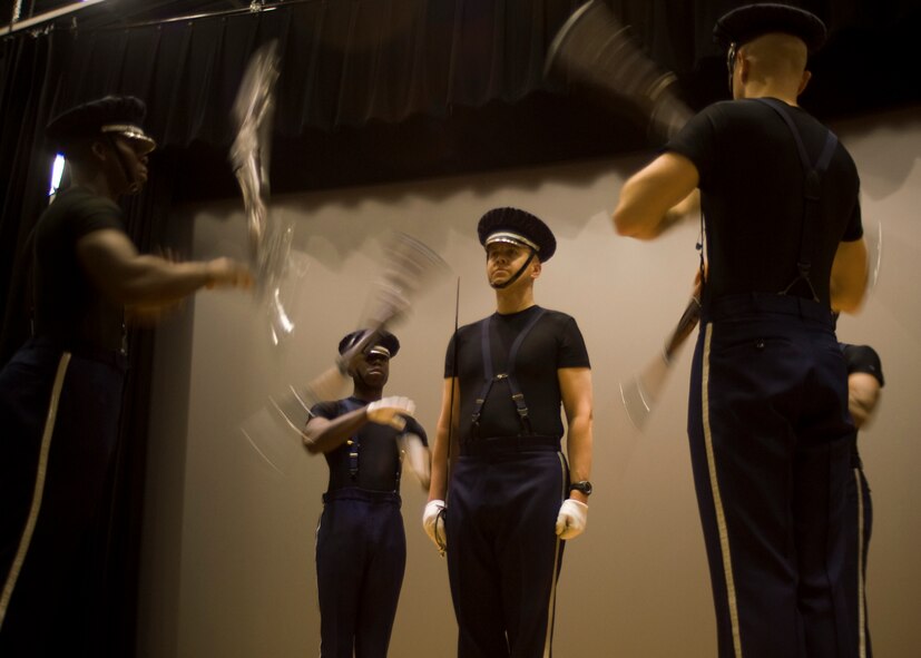 U.S. Air Force Ceremonial Honor Guardsmen practice their drill routine July 15, 2013, at Dyess Air Force Base, Texas. The Honor Guard presented their elite four-rifle routine at the base theater encouraging Dyess Airmen to apply to join. (U.S. Air Force photo by Airman 1st Class Peter Thompson/Released)