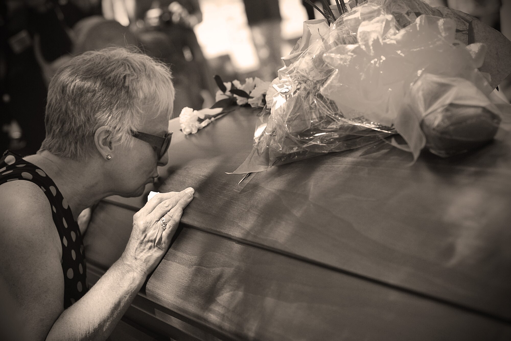 Relatives and friends pay their respects to Maj. Larry Hanley during his funeral service in Walla Walla, Wash., July 13, 2013. Hanley, piloting an F-105D Thunderchief, crashed in Khammouan Province, Laos, while attacking an enemy anti-aircraft position on Nov. 4, 1969, during the Vietnam War.  (U.S. Air Force photo by Senior Airman Taylor Curry/Released)