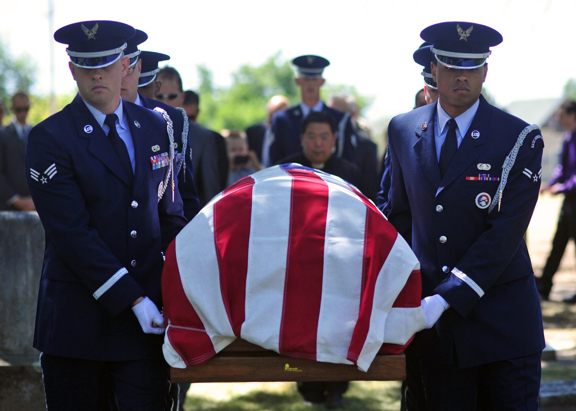 Fairchild Air Force Base honor guard members carry the casket of Maj. Larry Hanley during his funeral service in Walla Walla, Wash., July 13, 2013. Honor guard members were in attendance to present the colors and perform a three-round volley salute as well. (U.S. Air Force photo by Senior Airman Taylor Curry/Released)
