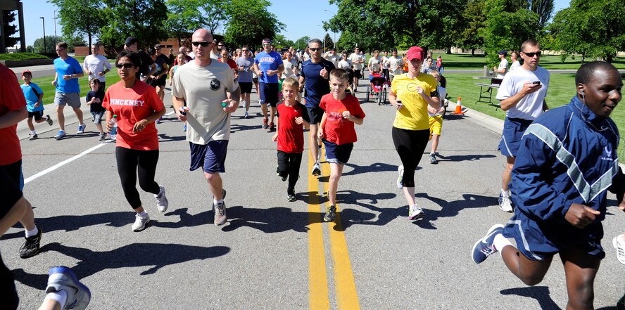Members of Team Fairchild run during the Shell 77 memorial 5K run at Fairchild Air Force Base, Wash., July 13, 2013. Tanker bases across the nation participated in the run honoring the crew of Shell 77. (U.S. Air Force photos by Airman 1st Class Ryan Zeski/Released)
