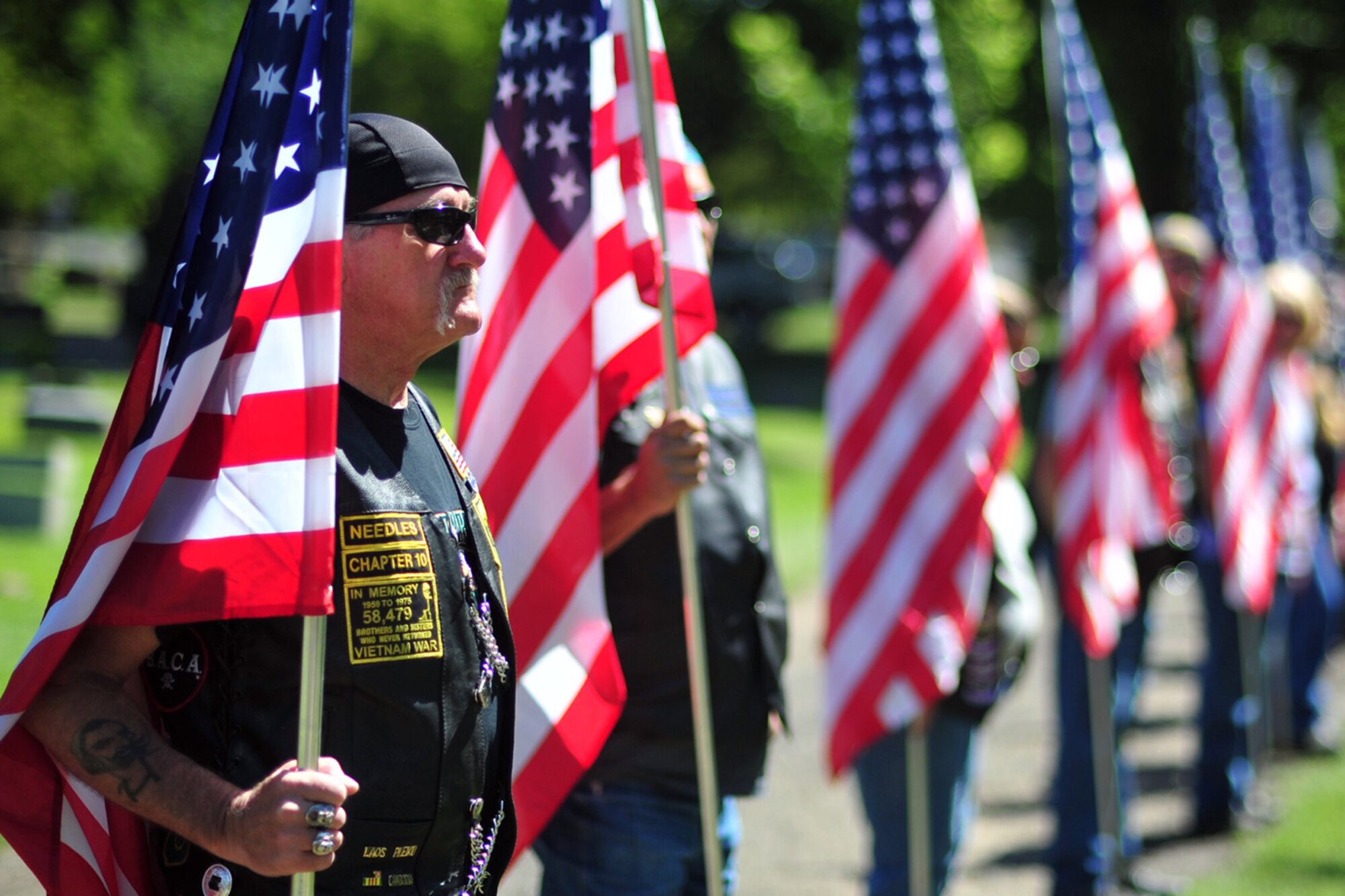 Patriot Guard Riders make a formation at Maj. Larry Hanley’s funeral service in Walla Walla, Wash., July 13, 2013. Hanley, piloting an F-105D Thunderchief, crashed in Khammouan Province, Laos, while attacking an enemy anti-aircraft position on Nov. 4, 1969, during the Vietnam War. (U.S. Air Force photo by Senior Airman Taylor Curry/Released) 
