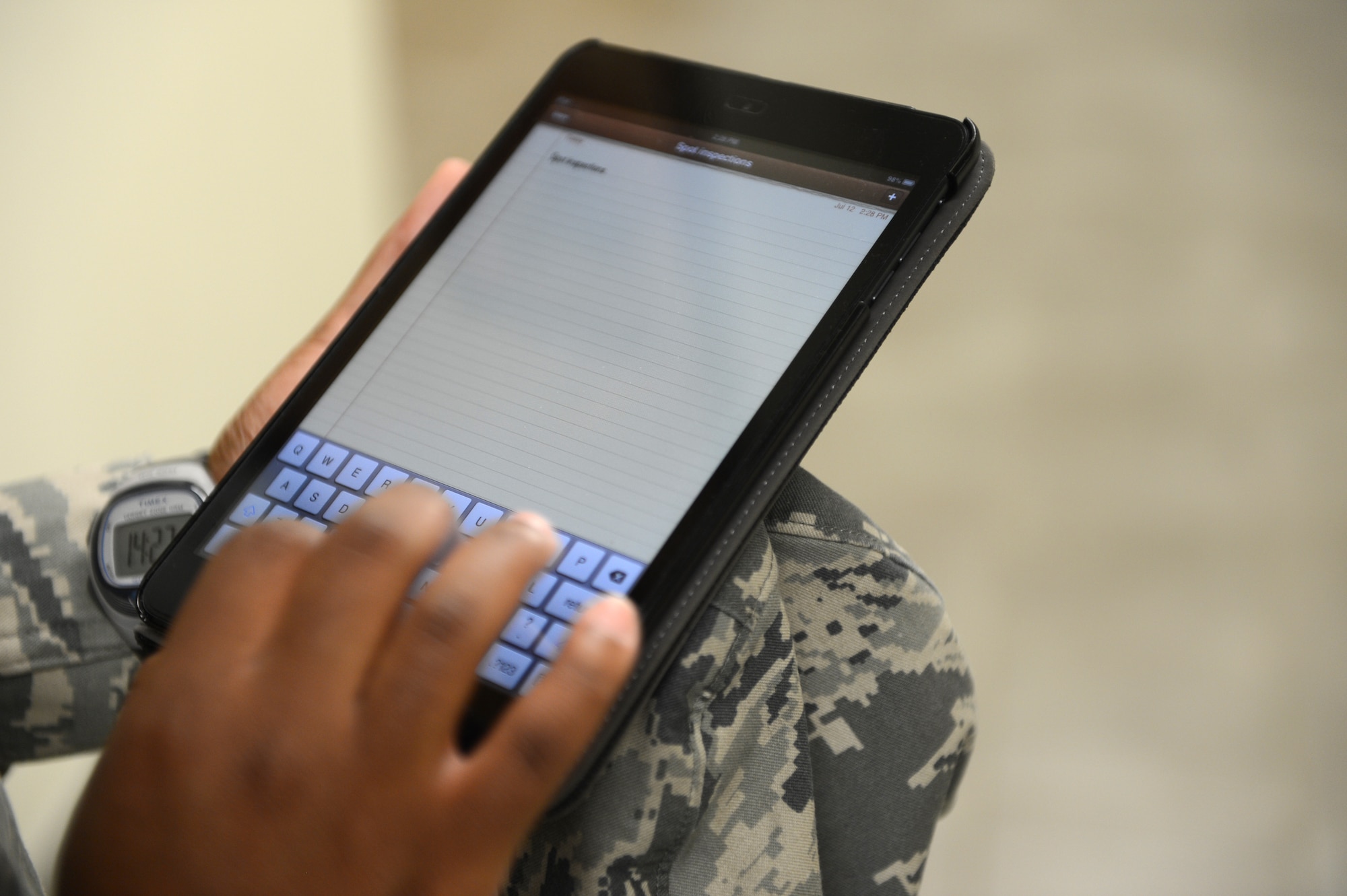 Tech. Sgt. Biagi Borrero (center), 20th Fighter Wing NCO in charge of ground safety, annotates potential safety hazards on her tablet during a spot inspection at Shaw Air Force Base, S.C., July 12, 2013. The wing safety office conducts spot inspections to indentify safety hazards and ensure Air Force Instruction compliance. (U.S. Air Force photo by Airman 1st Class Daniel Blackwell/Released)