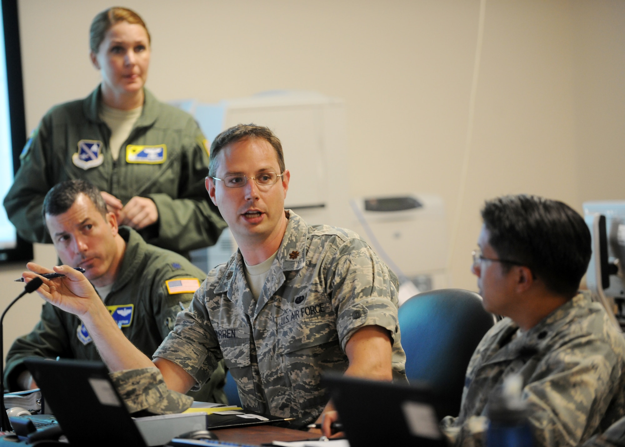 Maj. Charles Warren, 11th Wing Judge Advocate attorney, speaks with members of the Crisis Action Team during a meeting at Joint Base Andrews, Md., July 16, 2013. Joint base Andrews may be without water for two to five days while repairs are made to a failing pipeline in Prince George's County. (U.S. Air Force photo/Staff Sgt. Nichelle Anderson)  