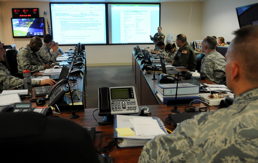 Lt. Col. Anne Marie Contreras Crisis Action Team director speaks with senior leadership during a meeting at Joint Base Andrews, Md., July 16, 2013.  Andrews may be without water for two to five days while repairs are made to a failing pipeline located in Prince George’s County. (U.S. Air Force photo/ Staff Sgt. Nichelle Anderson)  