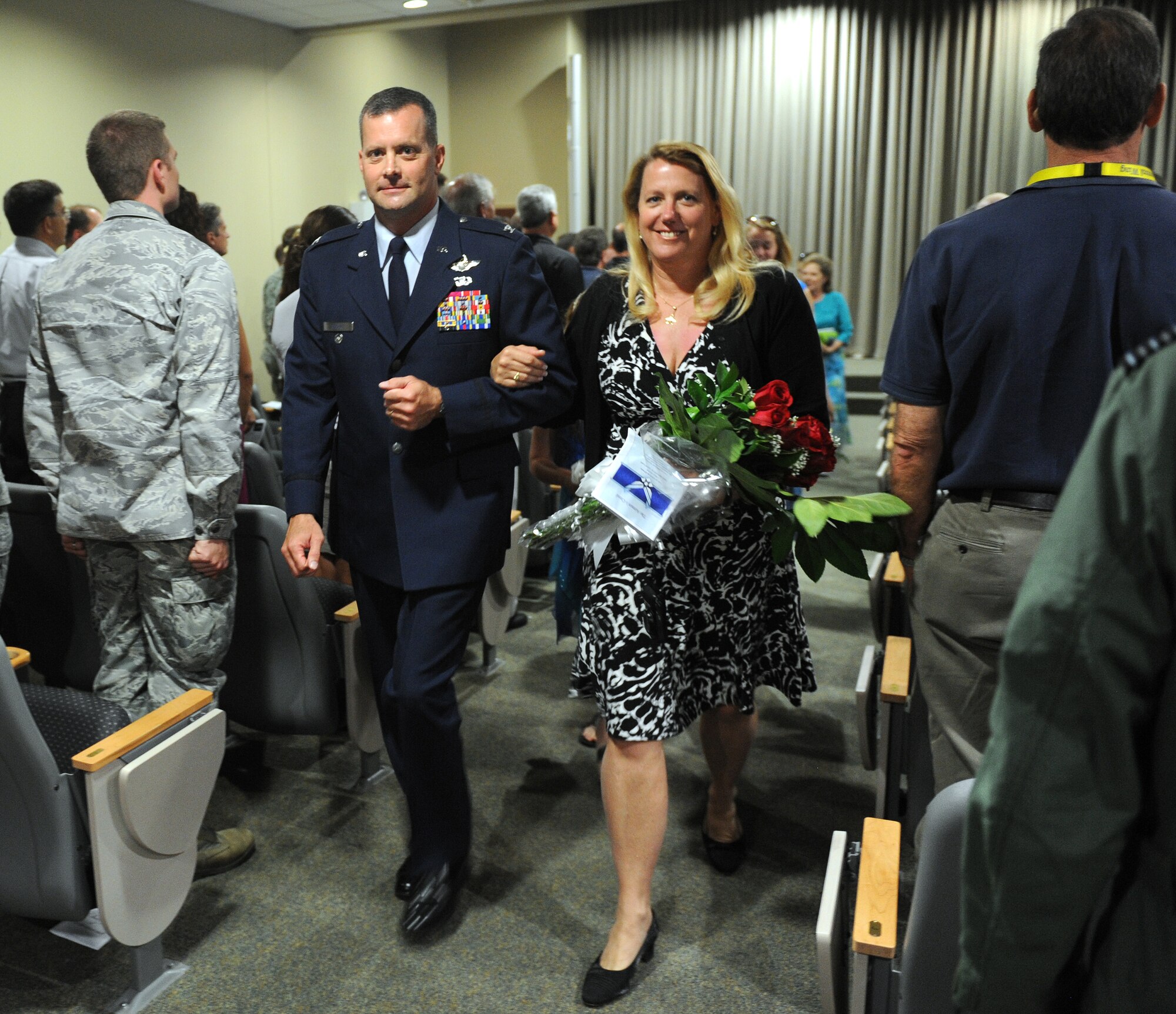 Col. Daniel Orcutt, commander of the 505th Command and Control Wing, and his wife depart the 505th CCW change of command ceremony on Hurlburt Field, Fla., July 9, 2013. Outgoing commander Col. Mustafa Koprucu passed command of the 505th CCW to Orcutt during the ceremony.