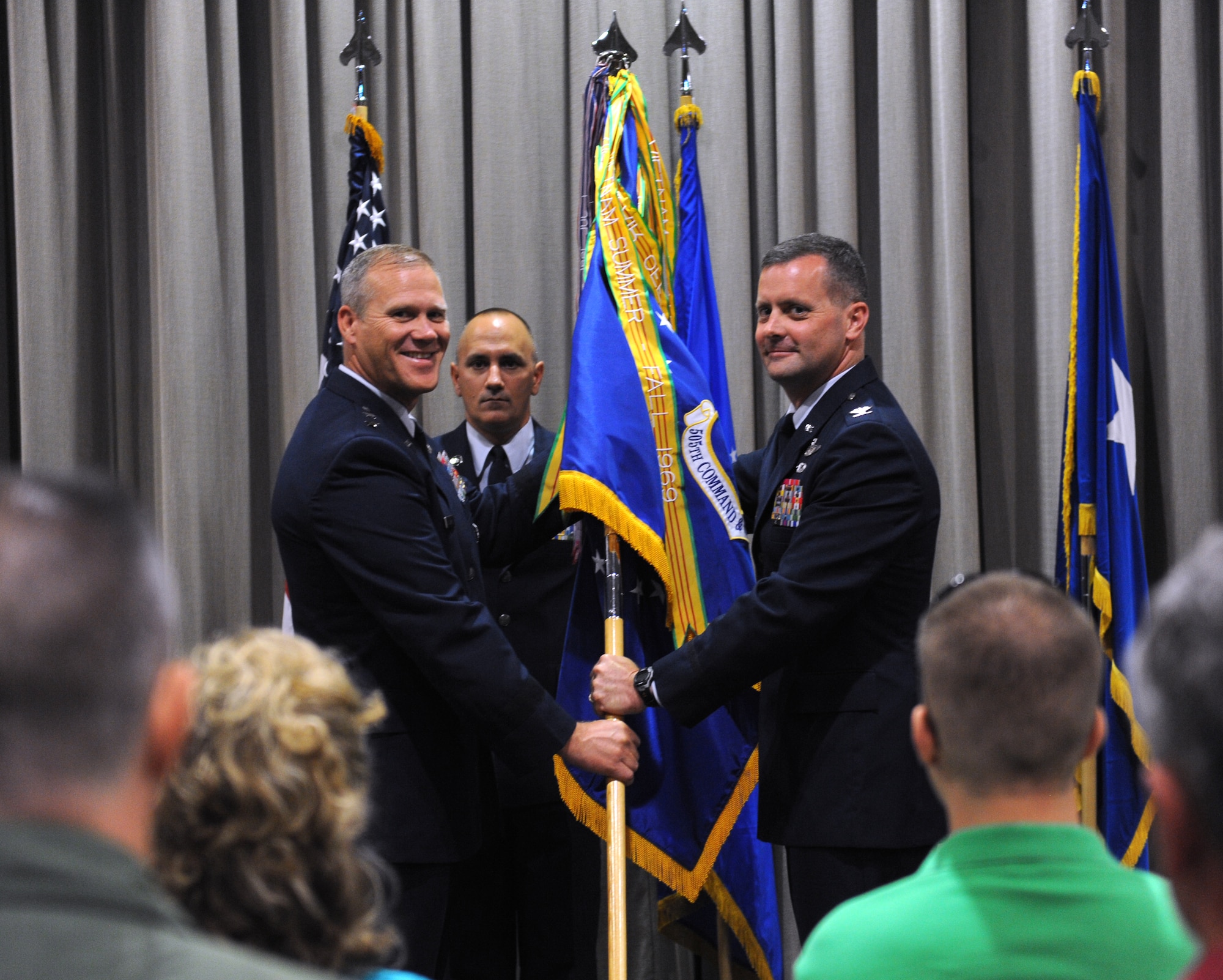 Col. Daniel J. Orcutt, right, incoming commander of 505th Command and Control Wing, accepts the 505th CCW guidon and control of the unit from Maj. Gen. Jeffery Lofgren, commander of U.S. Air Force Warfare Center, during a change of command ceremony on Hurlburt Field, Fla., July 9, 2013. “It is a humbling experience to be entrusted with the lives of such outstanding warriors as the men and women standing before us today,” Orcutt said. (U.S. Air Force photo by Senior Airman Kentavist P. Brackin)