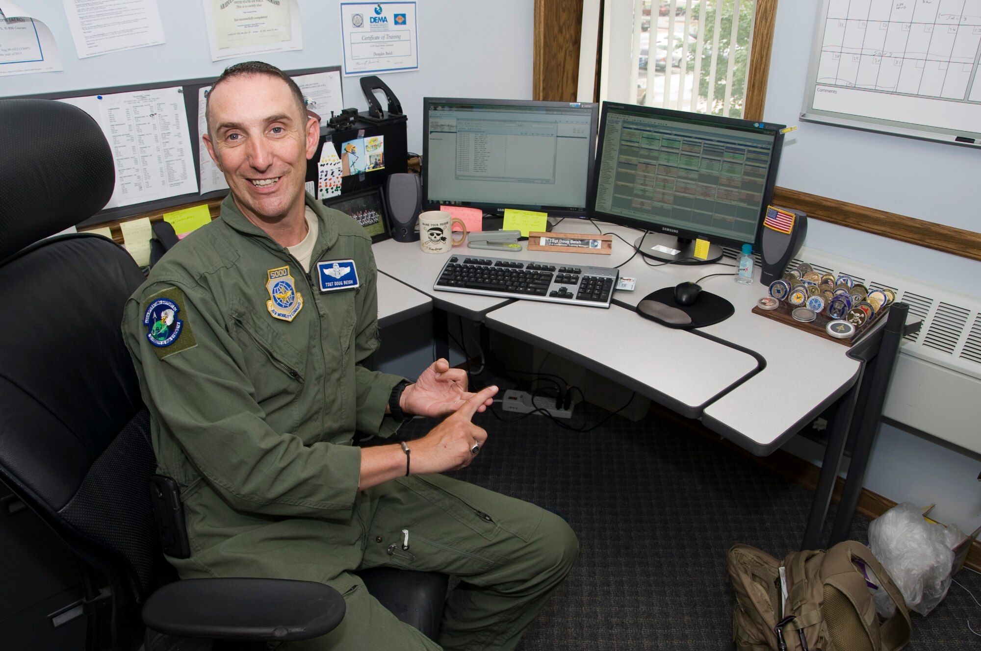 Tech. Sgt. Doug Beish, 436th Operations Support Squadron aircrew training C-5 Globemaster III loadmaster training, poses for a picture at the 436th OSS training flight at Dover Air Force Base, Del., July 12, 2013. While deployed in July to December 2010 he was deployed with the Air Mobility Director U.S.  Special Operations Command as a liaison between special operations commands and conventional airlift commands. The work he did time earned him the respect of those commands and a Bronze Star Medal. (U.S. Air Force photo/Senior Airmen Jared Duhon)