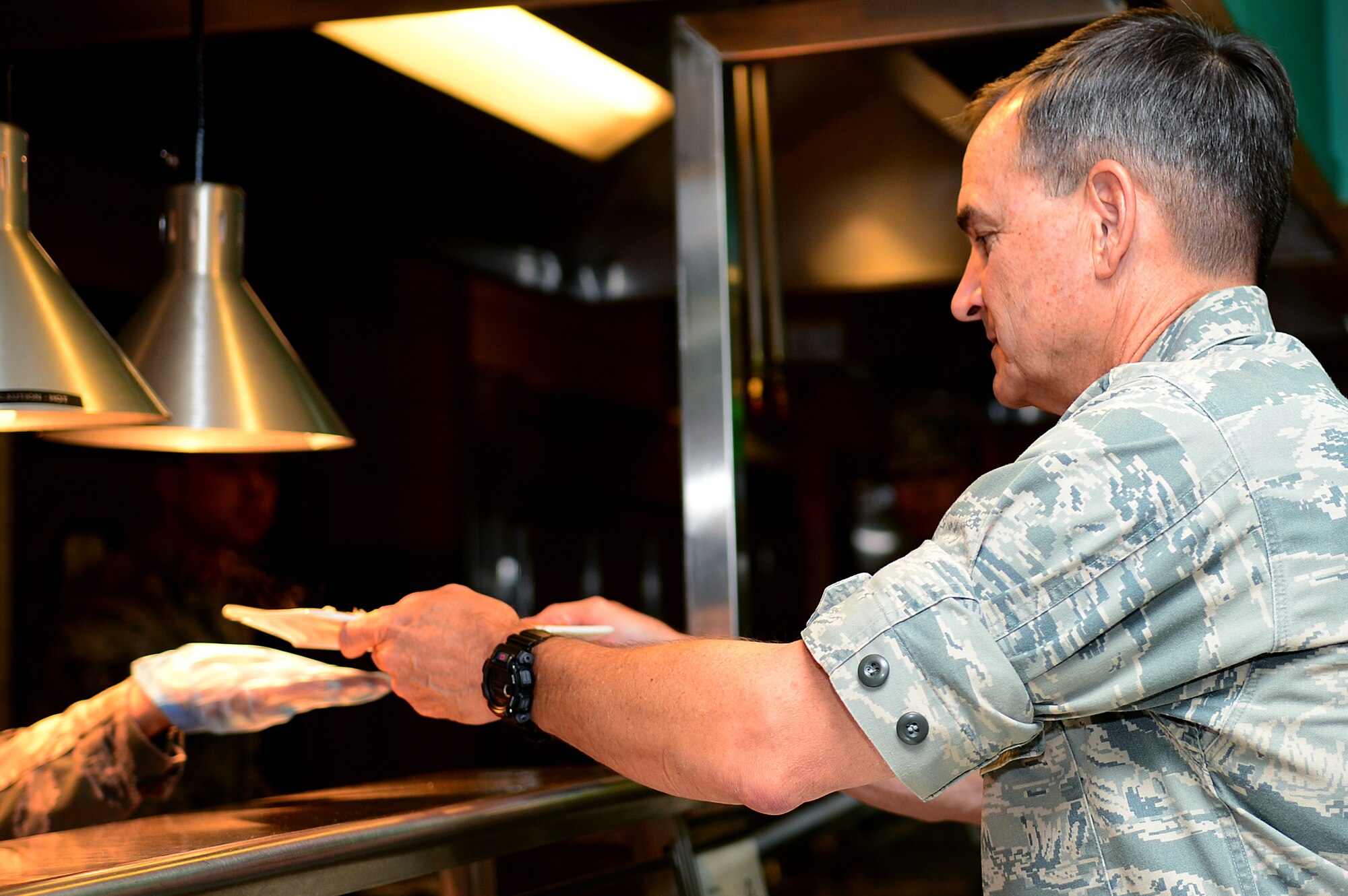 U.S. Air Force Maj. Gen. H.D. Polumbo Jr., 9th Air Force commander, makes a stop at the Crossbow Dining Facility as part of his base tour at Langley Air Force Base, Va., July 16, 2013. Polumbo met with first sergeants from around the base to discuss a wide variety of topics in today’s Air Force. (U.S. Air Force photo by Senior Airman Kayla Newman/Released)
