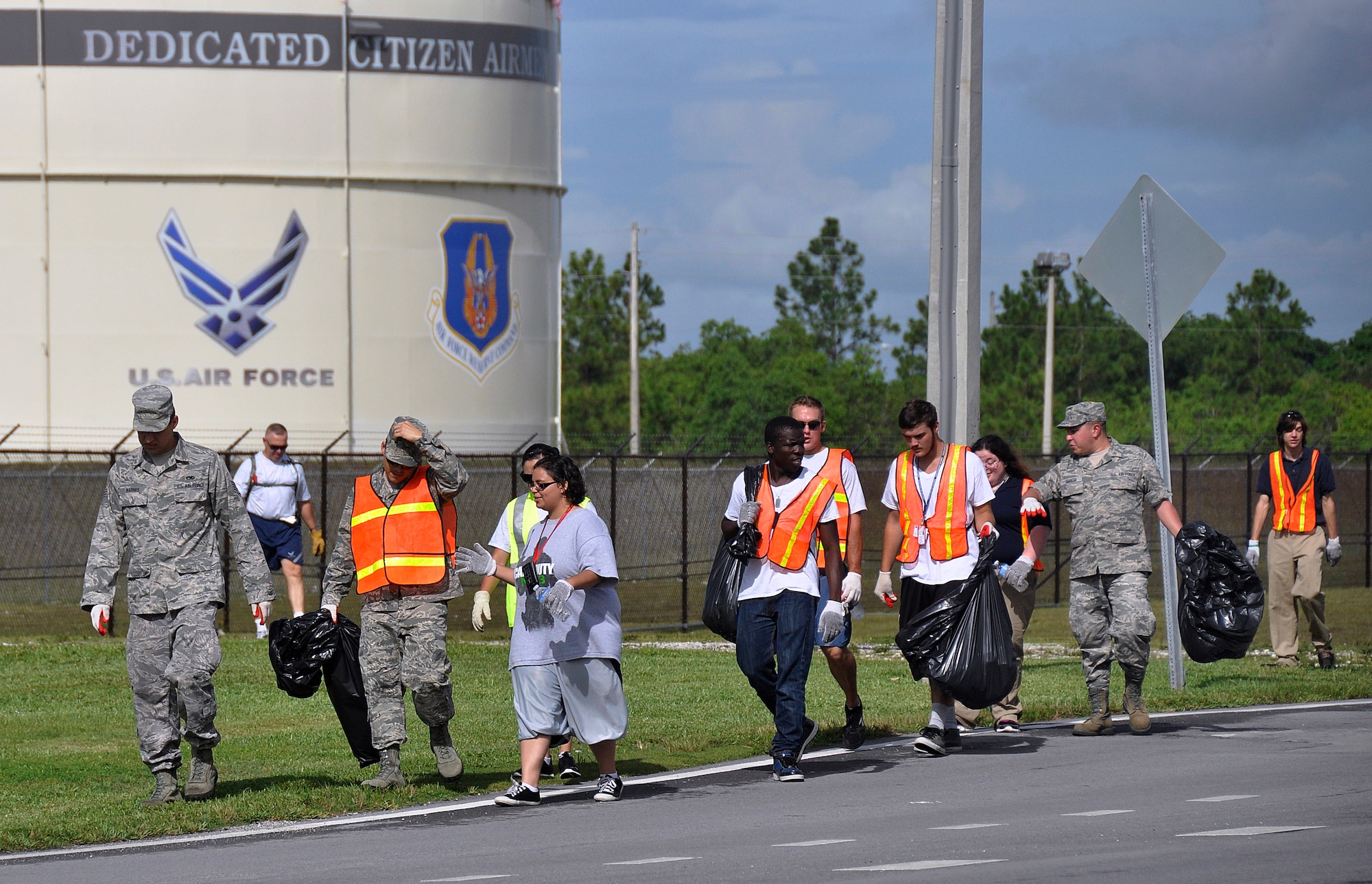 Airmen from Homestead Air Reserve Base teamed up with the Homestead Job Corps for a roadside cleanup July 9. The two groups got together to pick up trash along Southwest 288th Street, in front of the base and Homestead Job Corps. Homestead ARB and Homestead Job Corps have teamed up on numerous roadside cleanups. (U.S. Air Force photo/Tim Norton)