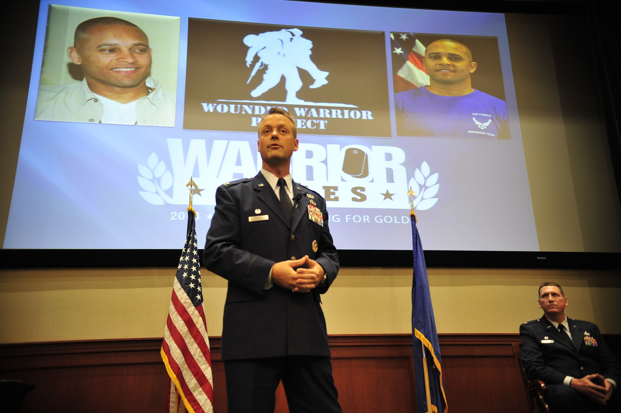 Col. James Hodges, 6th Mission Support Group commander, recognizes retired Staff Sgt. Jason Elis, former command post technician, May 23, 2013 at MacDill Air Force Base for completing his Community College of the Air Force associate’s degree after being medically retired from the Air Force. Ellis is the first wounded warrior to receive his degree after separation through the new CCAF Wounded Warrior program, which allows former members to complete their degrees after separation. (U.S. Air Force photo by Airman 1st Class Sarah Breer/Released)