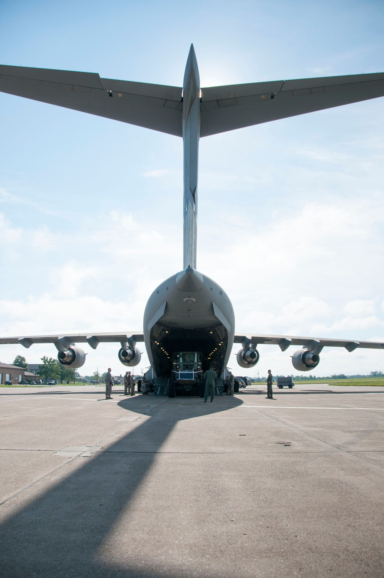 A C-17 from McGuire Air Force Base, N.J. is uploaded with an all-terrain forklift and a cargo-loader by Airmen of the 30th Aerial Port Squadron at the Niagara Falls Air Reserve Station, July 13, 2013.  The equipment and seven 30 APS Airmen will be stationed Ft. McCoy, Wisconsin in support of a Warrior Exercise, known as WAREX, slated to take place this month. The WAREX is a joint military training exercise for future contingency missions by ensuring proficiency in both technical and tactical skills. The 30th APS has been supporting WAREX and Global Medic since 2009. (U.S. Air Force Photo by Tech. Sgt. Andrew Caya)